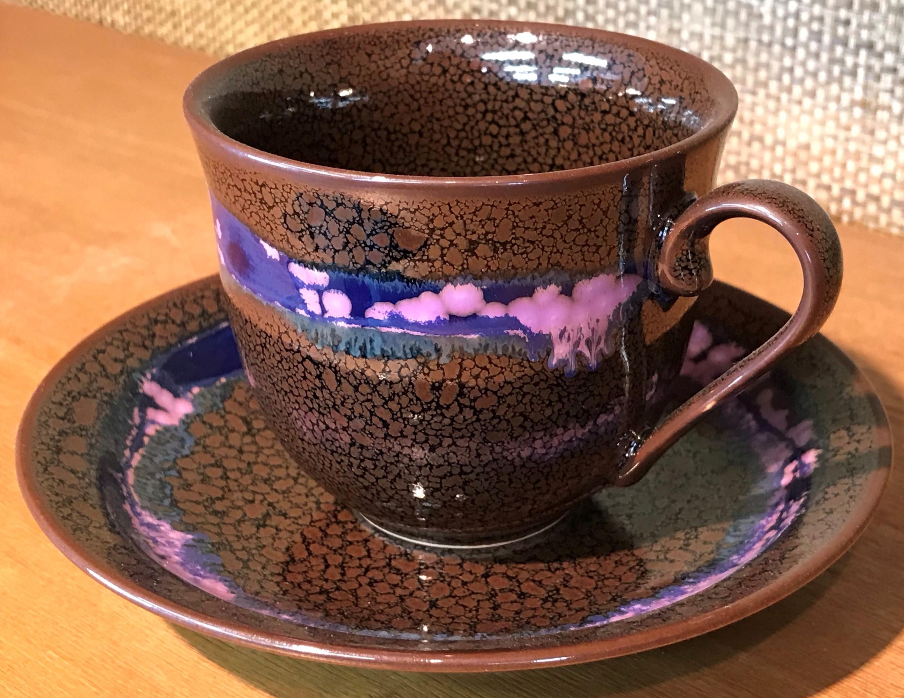 Exceptional Japanese contemporary porcelain cup and saucer, hand-glazed in striking brown and blue on a beautifully shaped body. This is a signed work by a highly acclaimed award-winning master porcelain artist from the Imari-Arita region of