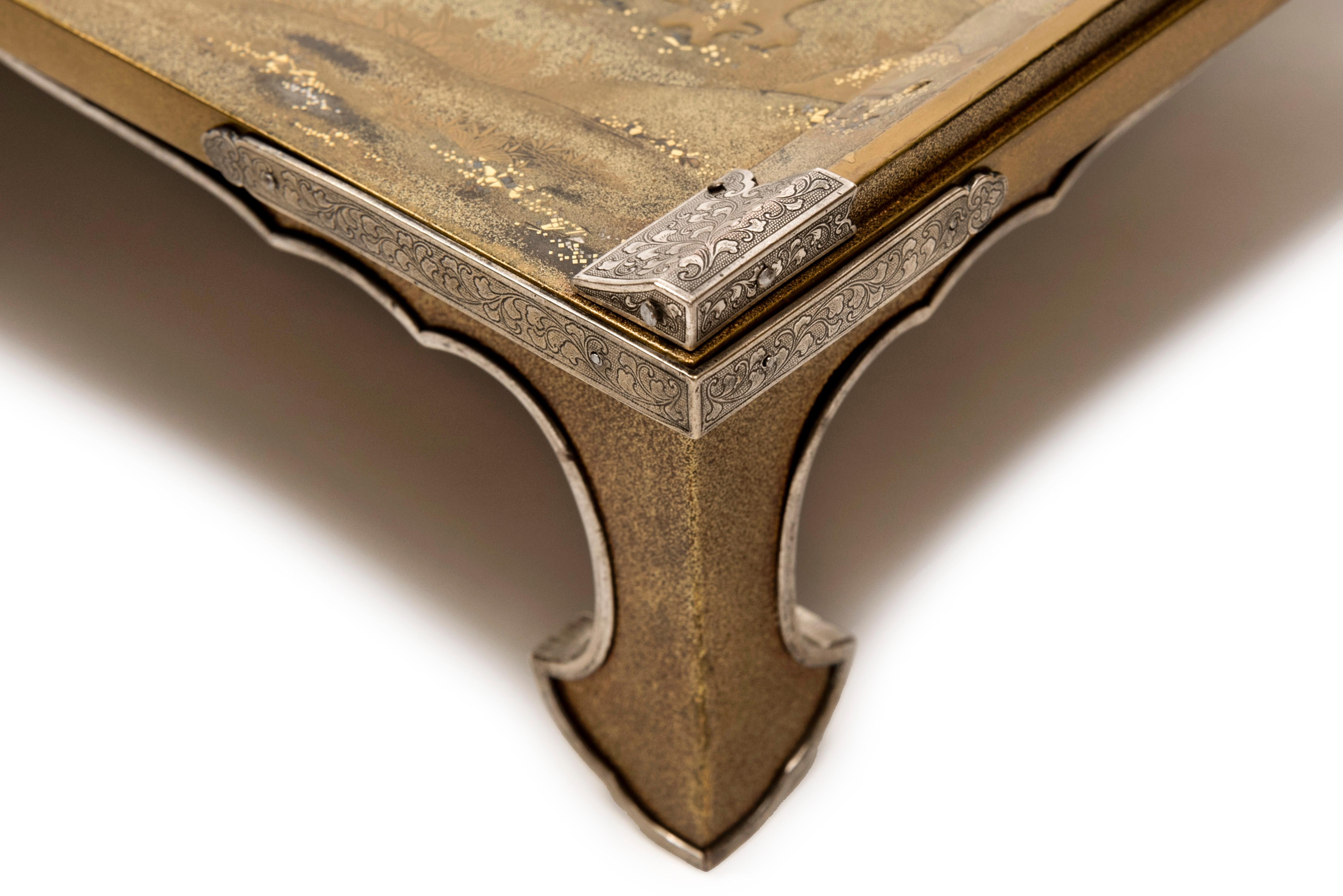 Gold Japanese Bundai or writting table in gold lacquer with a decor of lake landscape For Sale