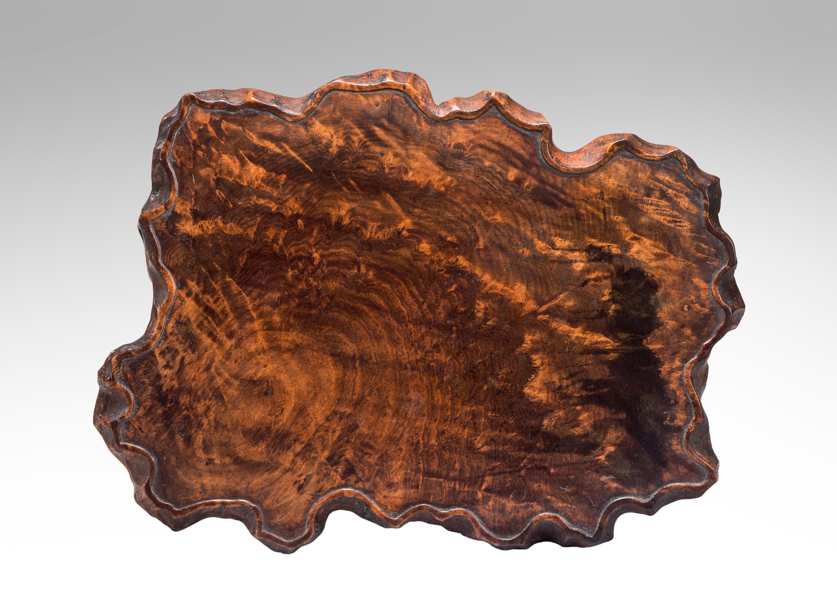 Japanese burl wood tray / stand
19th or early 20th century
This gorgeously figured burl wood tray /stand with a irregular edge adorned by a raised line exemplifies the profound understanding of the beauty of natural materials that Japanese