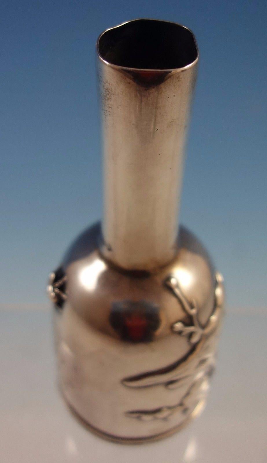 Japanese by Tiffany & Co. 
Stunning Japanese by Tiffany and Co. sterling silver bud vase featuring an applied bird on a branch, bug, and Japanese cherry blossom flowers. This piece is marked #3566M6433 and weighs 3.23 troy ounces. It measures 5