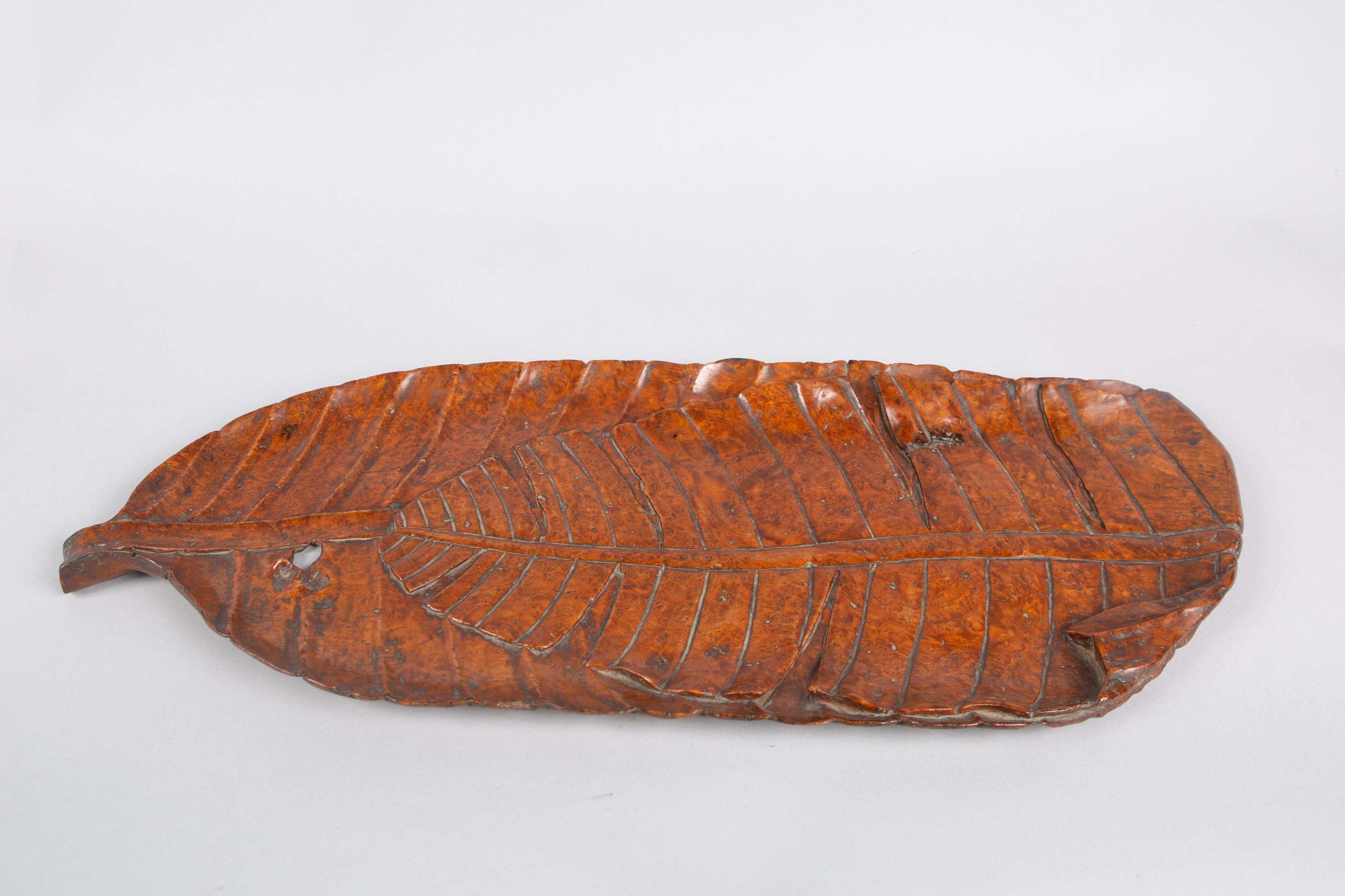 Meiji period (1868-1912) beautifully carved tray in the shape of a folded banana leaf, so the viewer can appreciate both sides of the leaf from a single vantage point. (Banana leaves were often folded to make a stronger serving plate.) Delicate and