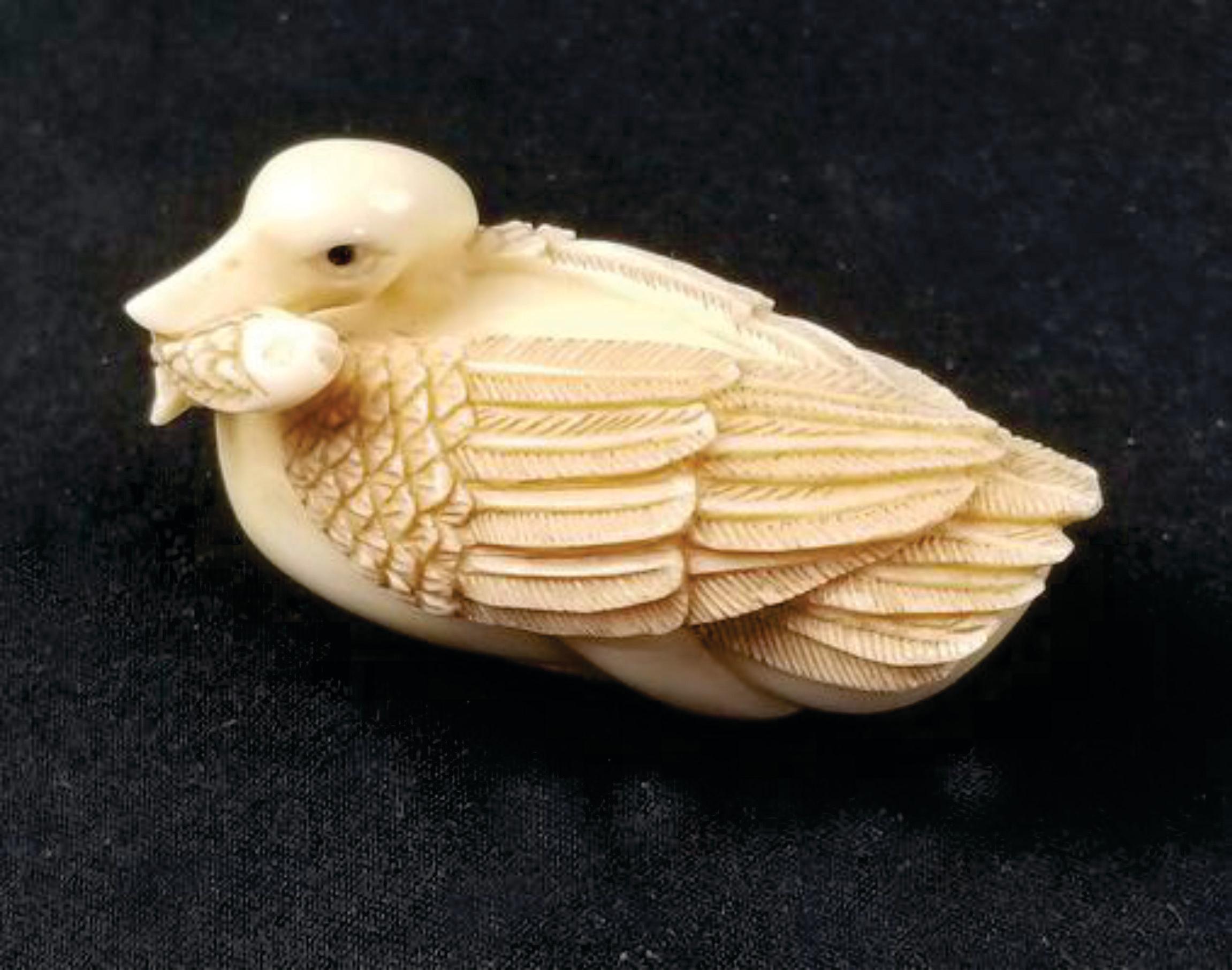 Netsuke Japanese Hand-Carved Mixed Material Figure, A Goose Biting a Fish-Signed by Tomotada from the Edo period. Ric.NA007

This item is 2