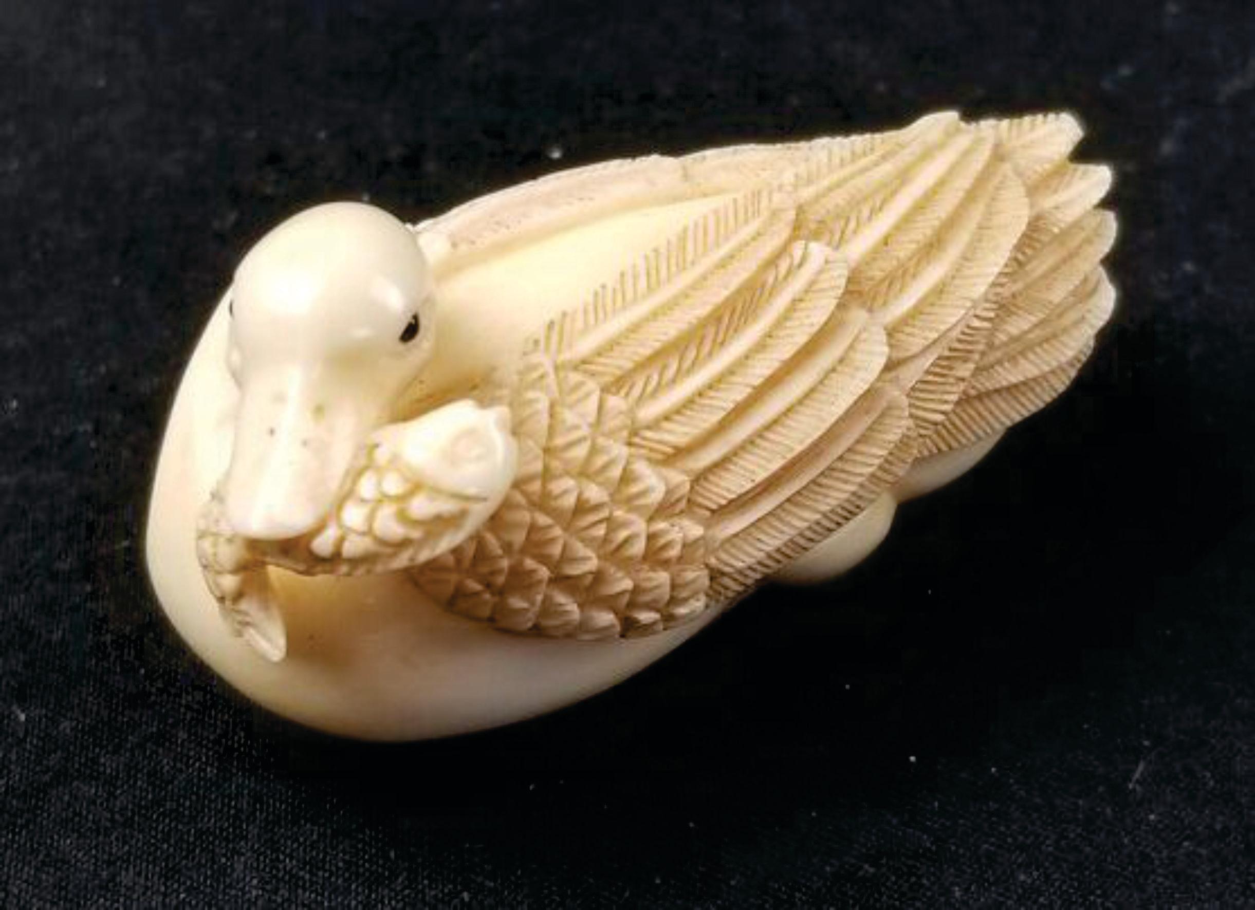 Japanese Carved Netsuke A Goose Biting a Fish-Signed by Tomotada, Meiji  In Excellent Condition For Sale In Norton, MA