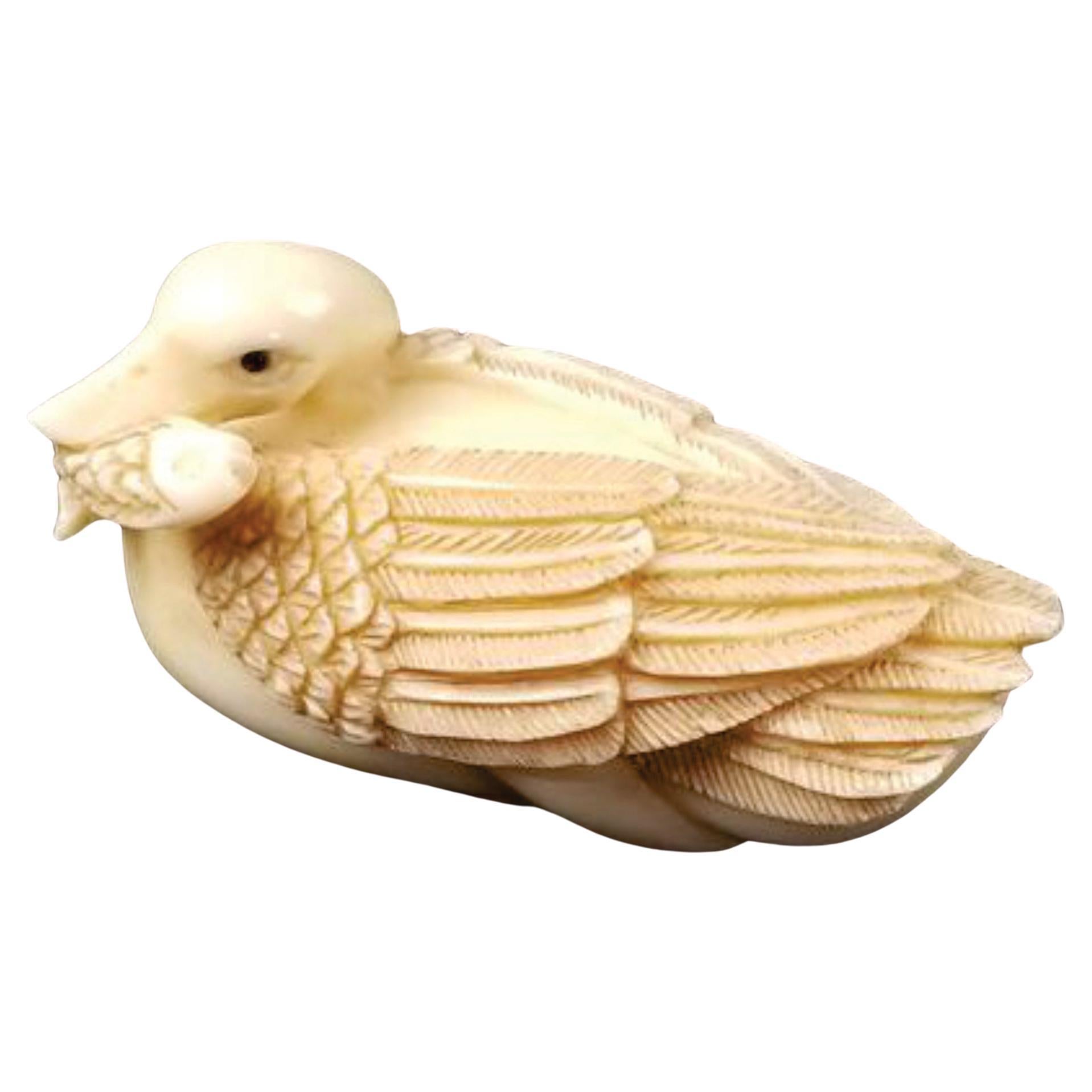 Japanese Carved Netsuke A Goose Biting a Fish-Signed by Tomotada, Edo For Sale
