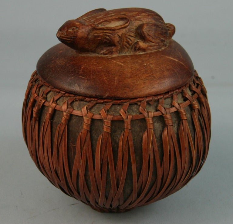 3-672 Japanese carved wood box with carved rabbit lid rapped with reed.