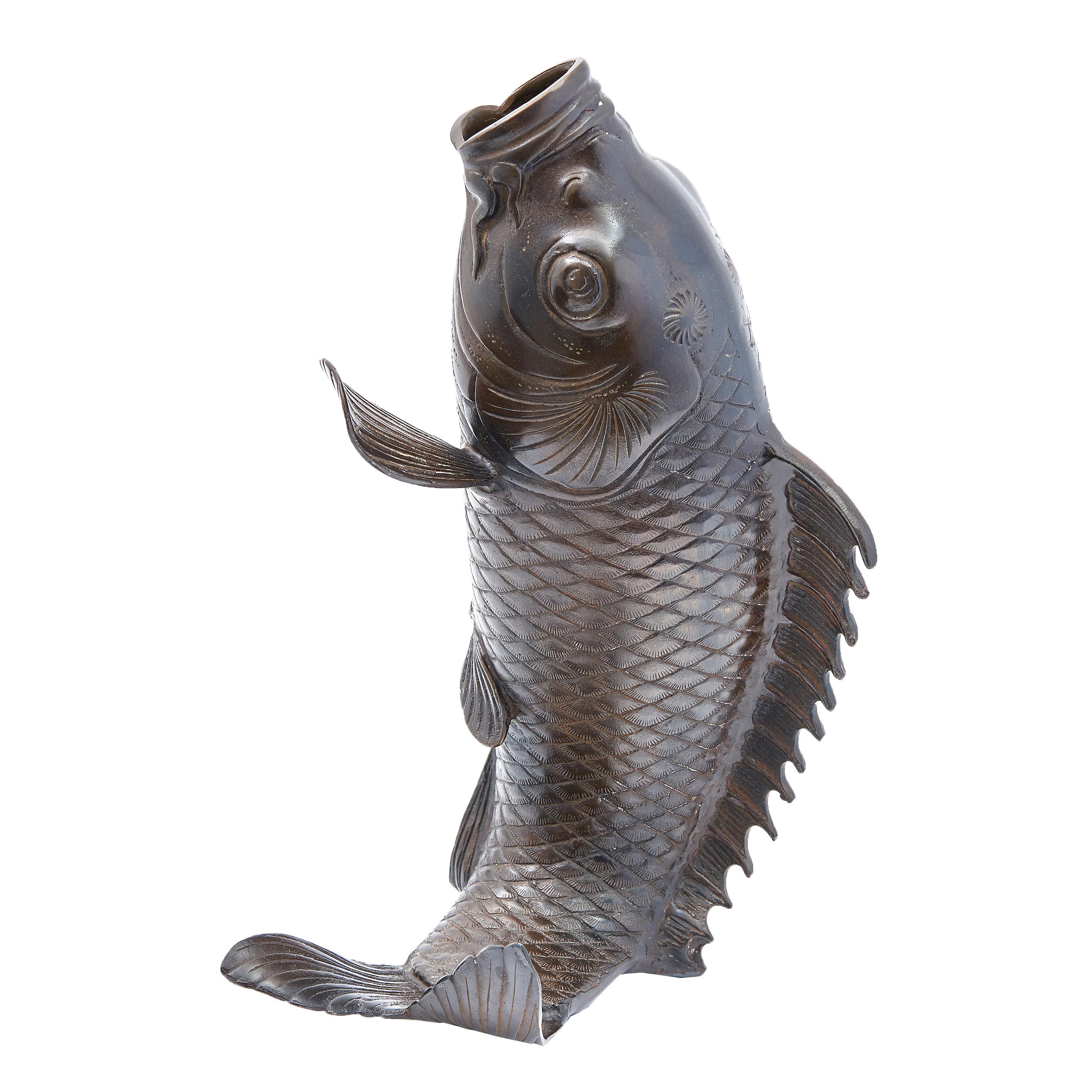 Japanese cast bronze vase in the form of a carp, mid-20th century. Realistic in form, with cross hatch scales, the mouth open to form a vase.

Eu sales subject to 20% VAT on this item.
 

            