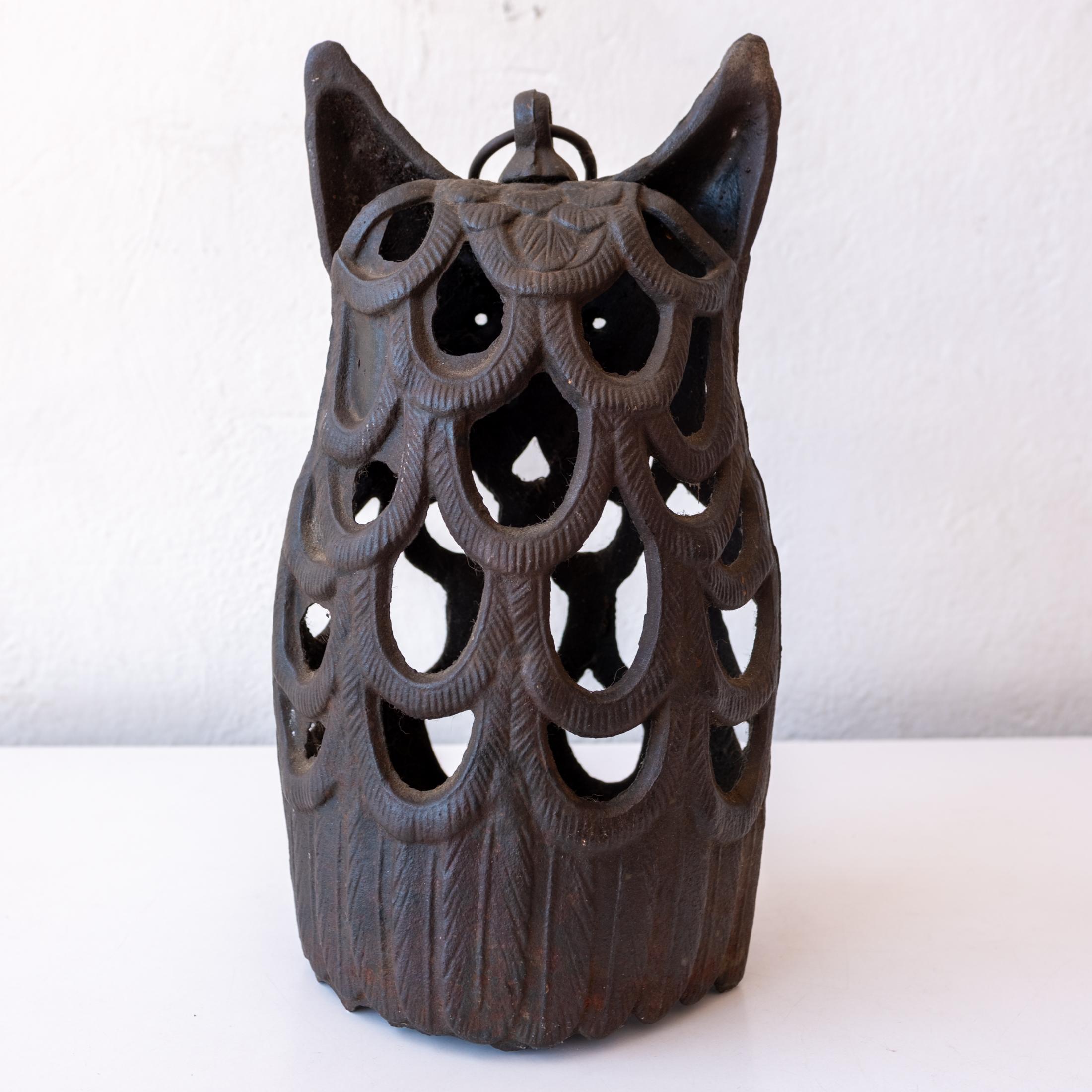 Stylized cast iron owl sculpture from Japan. Holds one candle. Nice patina throughout. Stamped JAPAN. 1960s