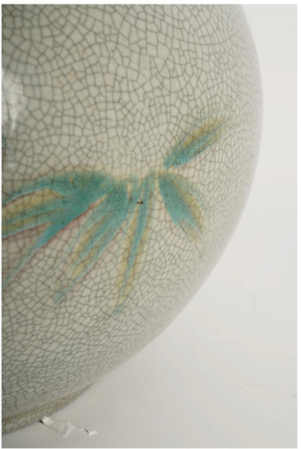 This is a large early 20th century Japanese crackled glazed celadon vessel that was most probably a Hibachi. The vessel is in very good condition showing a Zen quality achieved with the celadon glaze with minimalist palm images and intentional