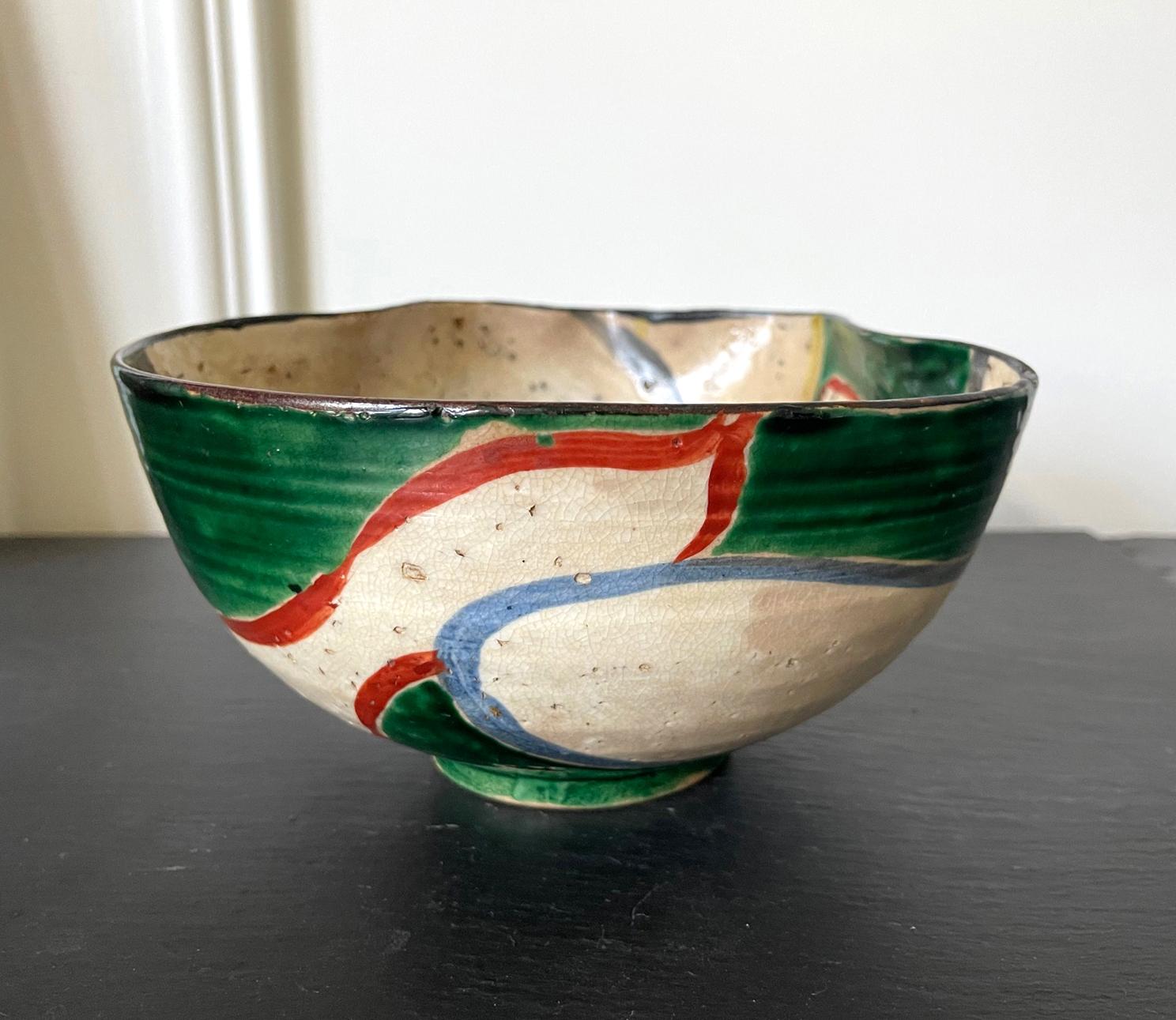 A free-free ceramic bowl with undulating rim from Japan, circa late 19th century Meiji period. The bowl features a abstract gourd design on both interior and exterior in a color scheme reminiscent of Kutani ware, but it was most likely made in Kyoto