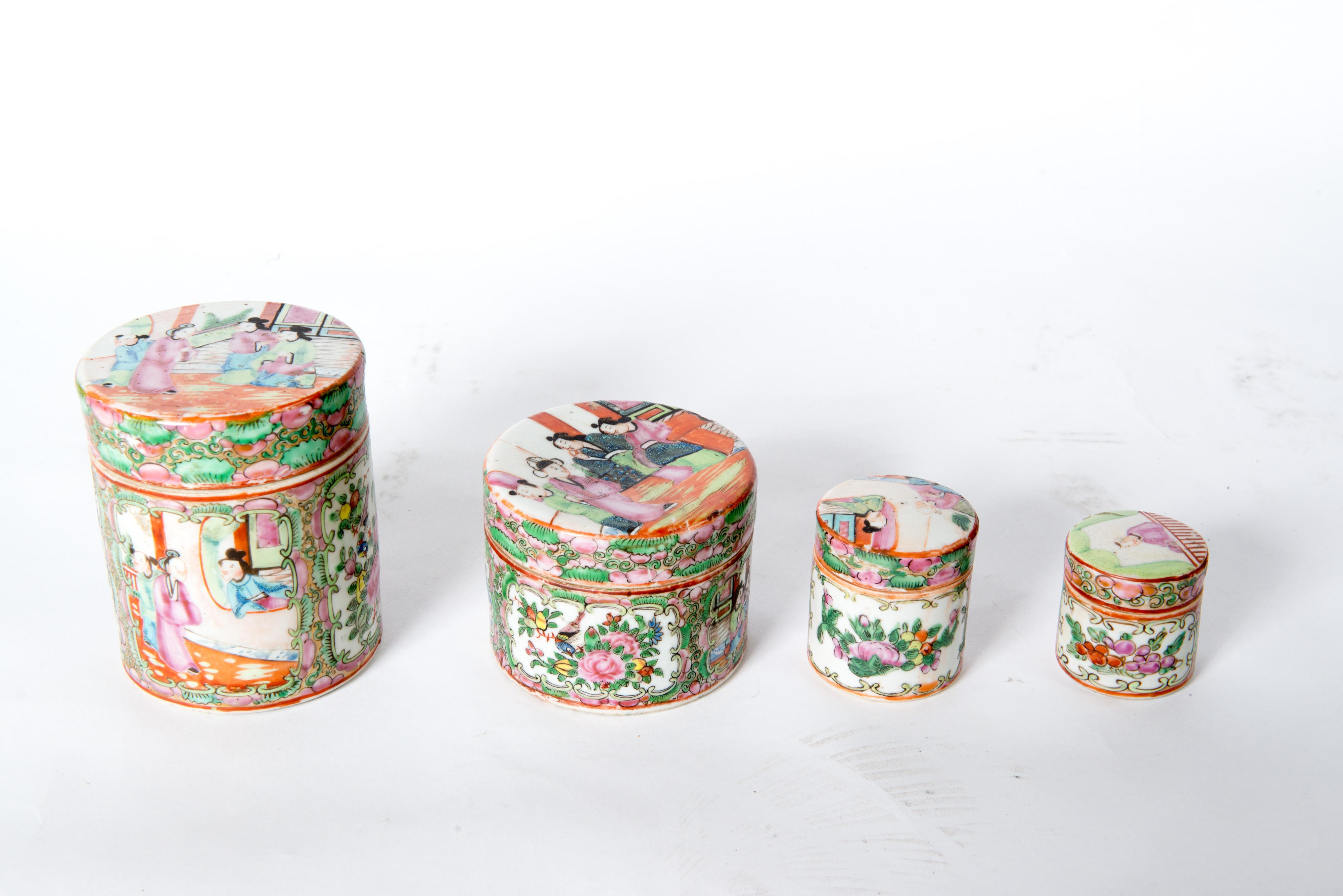 Set of four Japanese lidded porcelain jars. Second jar is 3.75 diameter, 3 high. Third jar is 2.25 diameter, 2.5 high. Fourth jar is 2 diameter, 2 high. 
The lid to the second largest jar is damaged. There is a piece missing on the rim.