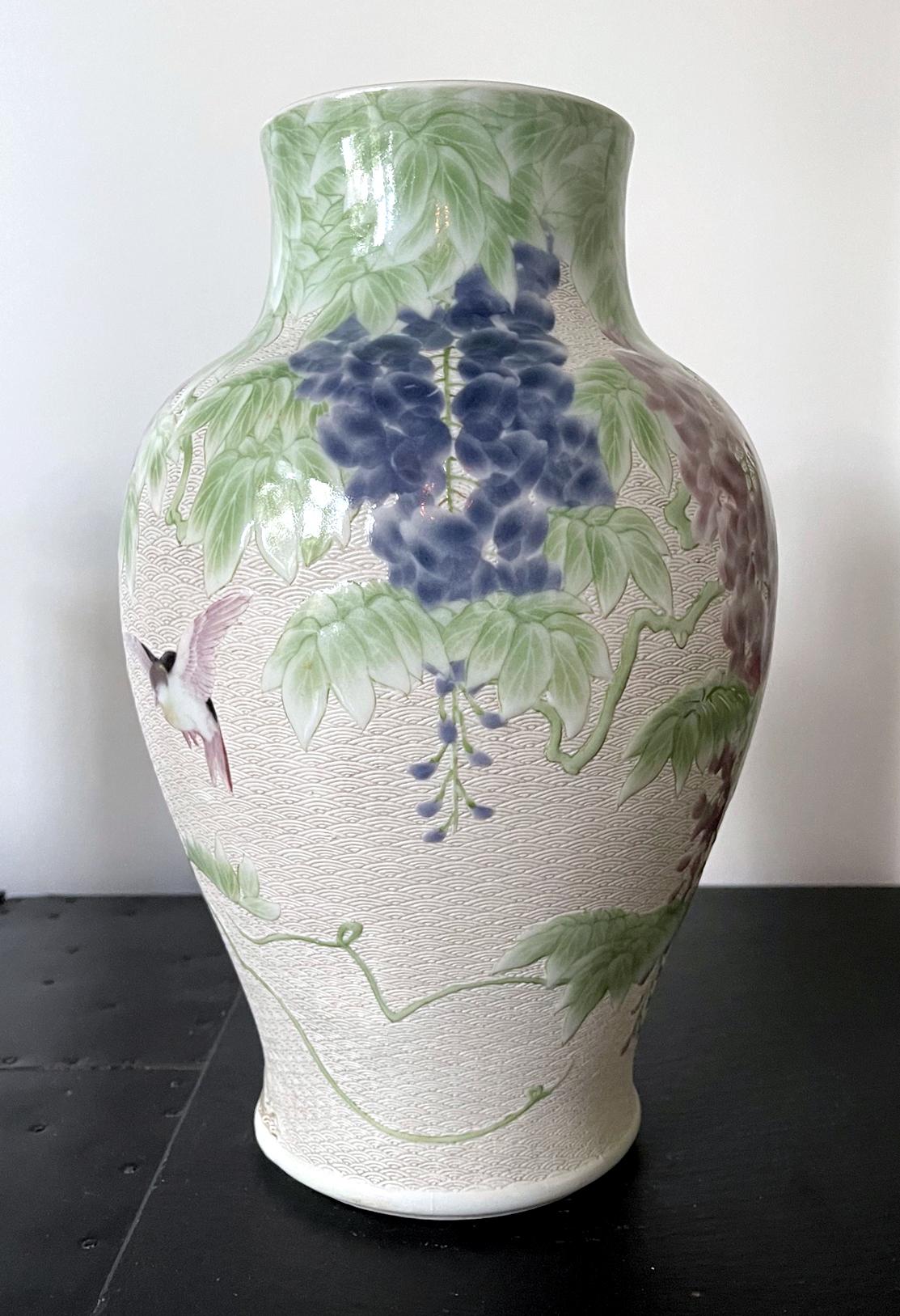 A large Japanese ceramic vase by the famous Meiji imperial potter Makuzu Kozan (1842-1916) circa 1887-1910. Dated to his underglaze phase post 1887 after he successfully mastered the new colors available from the west and used them to the best