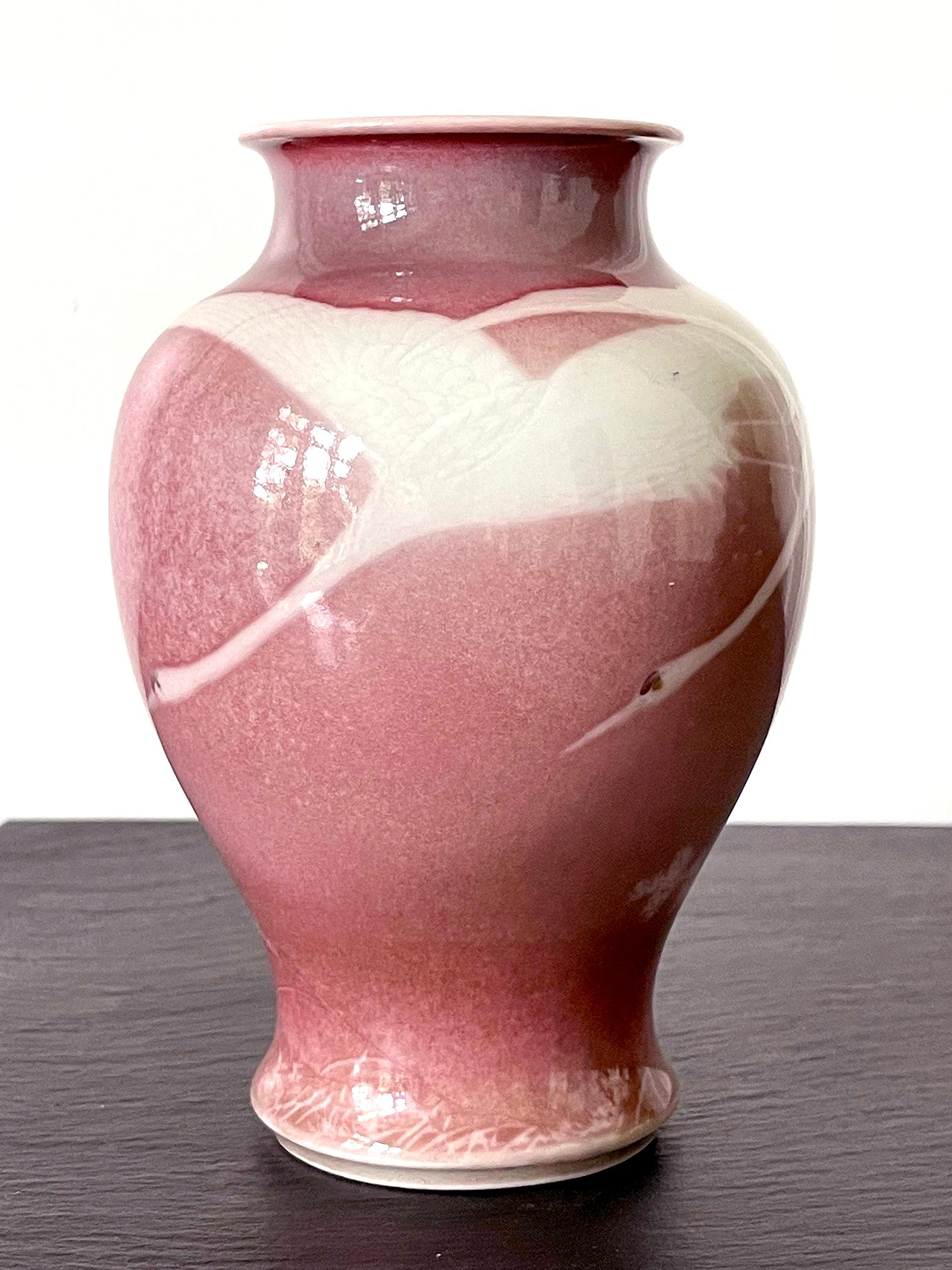 A small porcelain vase by Japanese Meiji imperial potter Makuzu Kozan (1842-1916), circa 1890-1910s. The vase is made in what is considered early phase of his underglaze period during late Meiji era. In a classic baluster form, the surface of the
