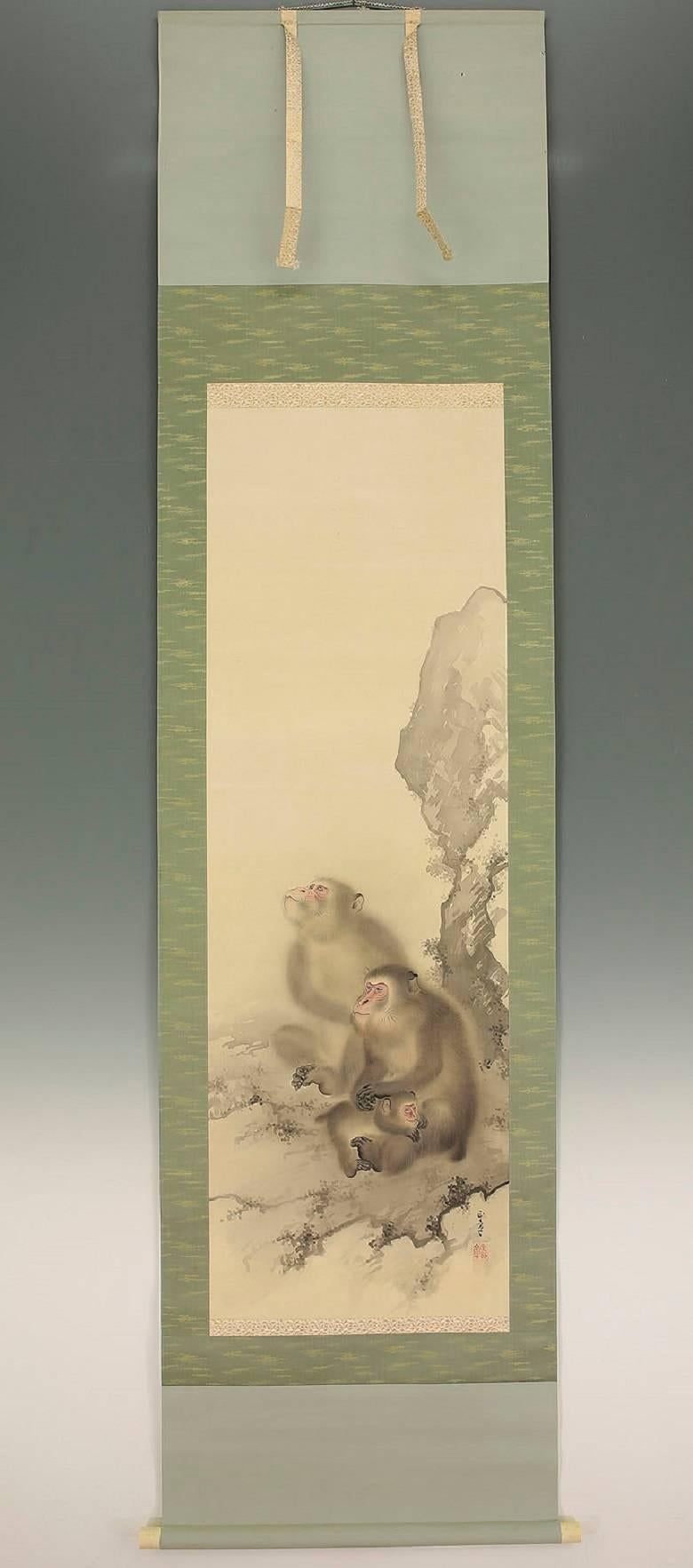 Japan, a charming family of three monkeys sit peacefully upon a branch in time of this auspicious hand-painted art composition on silk and dating to the middle Showa era mid-20th century.

Dimensions: 24 inches wide and 84.5 inches length.