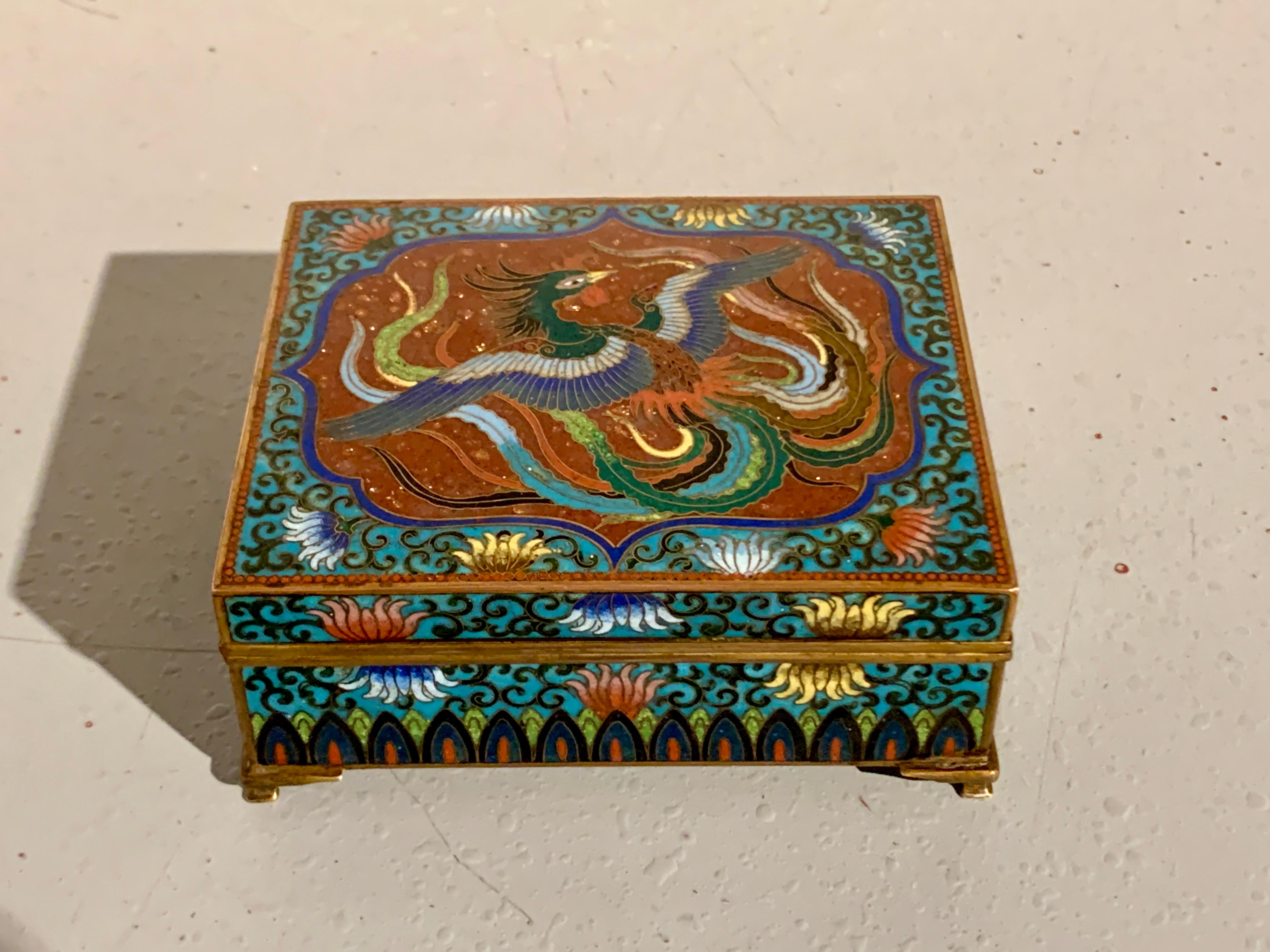 A striking Japanese turquoise ground cloisonne and goldstone trinket or jewelry box, Meiji Period, circa 1900, Japan.

The hinged top box set on raised feet and decorated in a wonderful array of cloisonne enamels. The top of the box features a