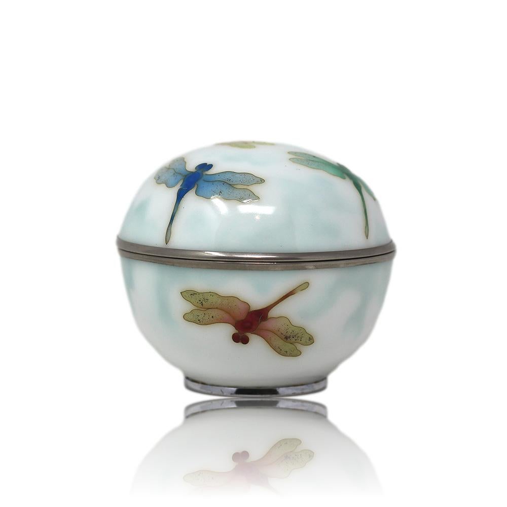 Japanese cloisonne enamel lidded spherical box late Meiji, early Tashio period. The box decorated with a milky white enamel with a bluet-green tint in various places amongst dragon flies in three different colours, red, green, and blue. The sphere