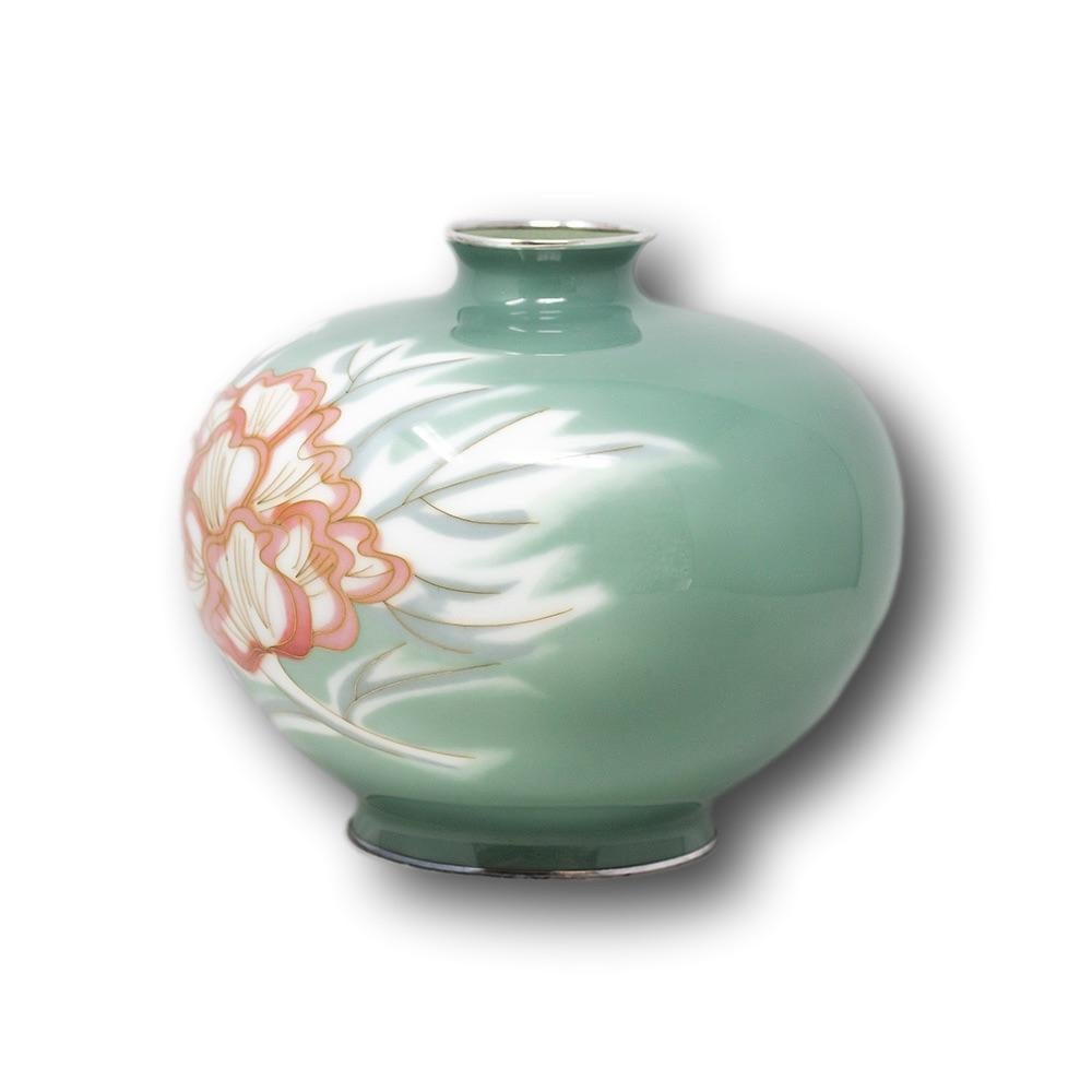 Japanese cloisonne enamel vase of large globular form, boldly decorated with a pastel green glaze surrounding florets of stylised peony flowers Tashio-early Showa period. The base signed to the centre with the Ando company mark and Jungin silver