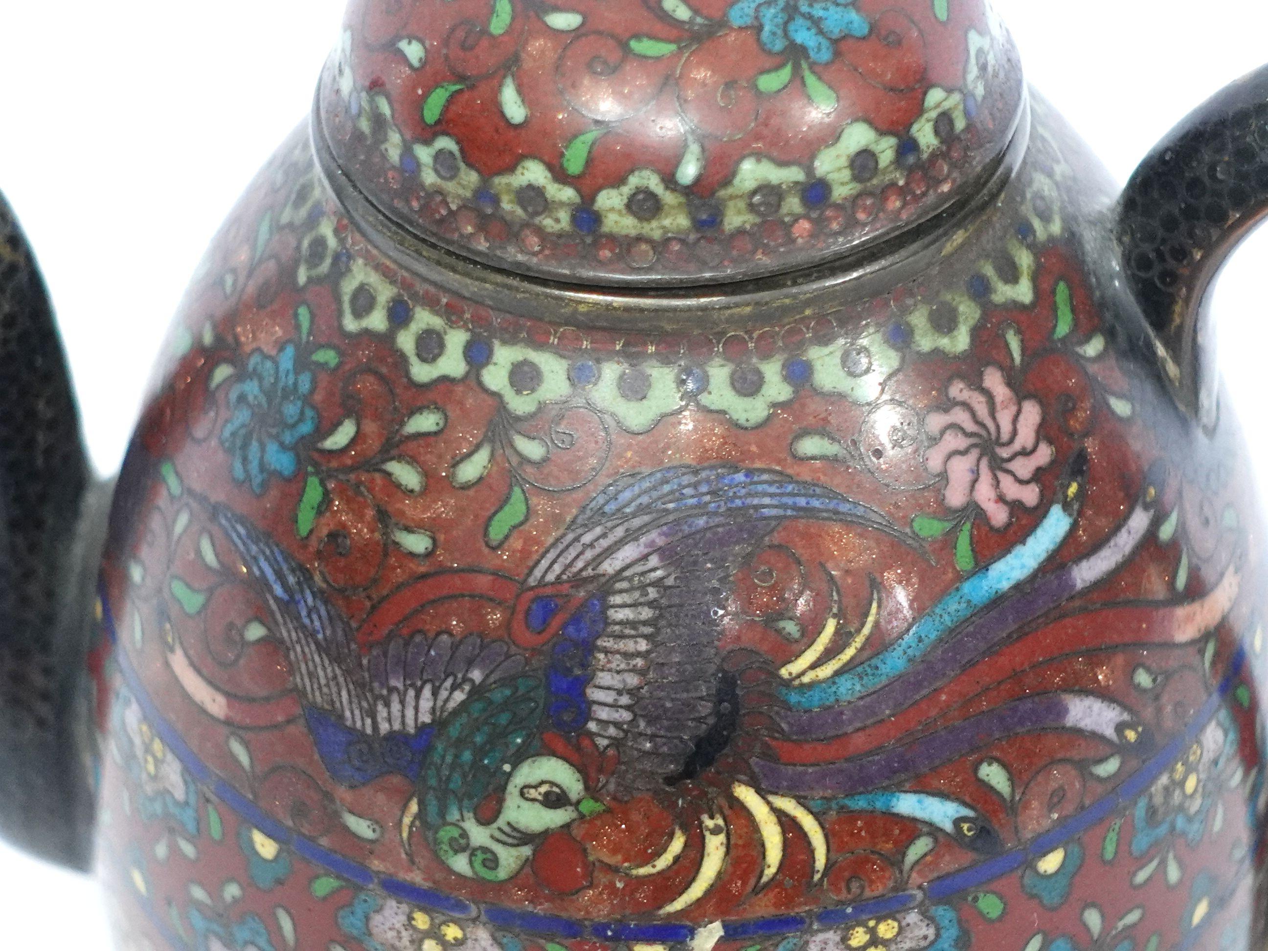 Quality work, amazing workmanship with absolutely fine details bronze cloisonné enameled teapot depicting the scene of a flying bird and lots of details of floral and patterns with vivid colors of yellow, light golden green, red, blue, brown, and