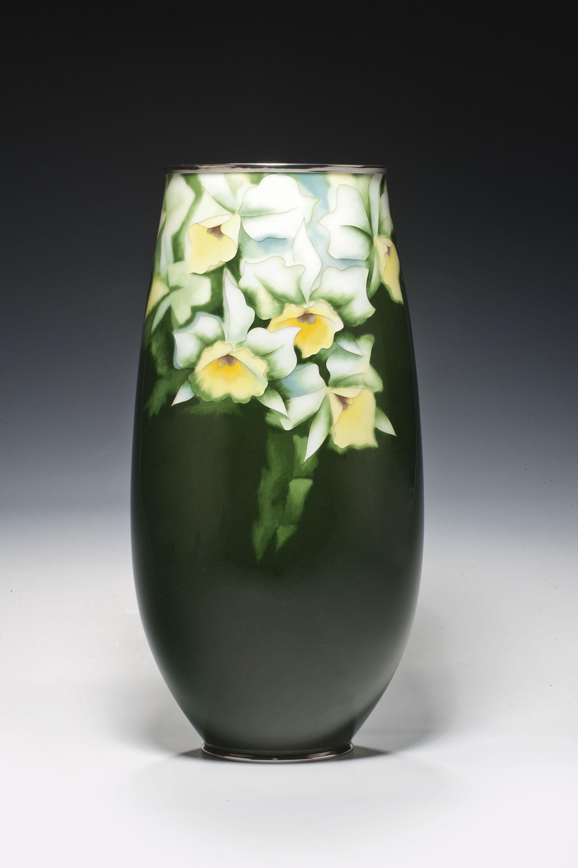 This dark green vase has yellow and white narcissi in yusen and musen enamels.

Literature: See Gregory Irvine, Japanese Cloisonne, V&A, 2006, page 97 for a similar example in the Victoria and Albert Collection.

Signed/Inscribed: Ando mark.