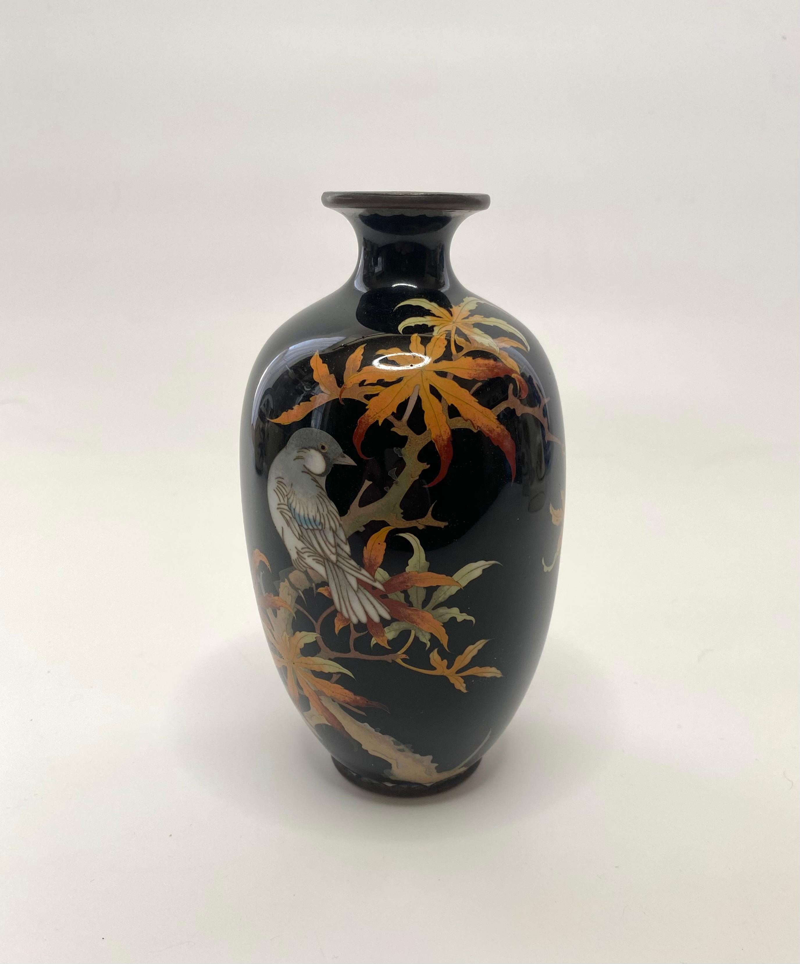 Japanese cloisonné vase, c. 1890, Meiji Period. The baluster shaped vase, attractively decorated in the style of Namikawa Sosuke, with a bird perched amongst autumnal leaves, on a branch. Worked in silver wire, and beautifully enamelled.All on a