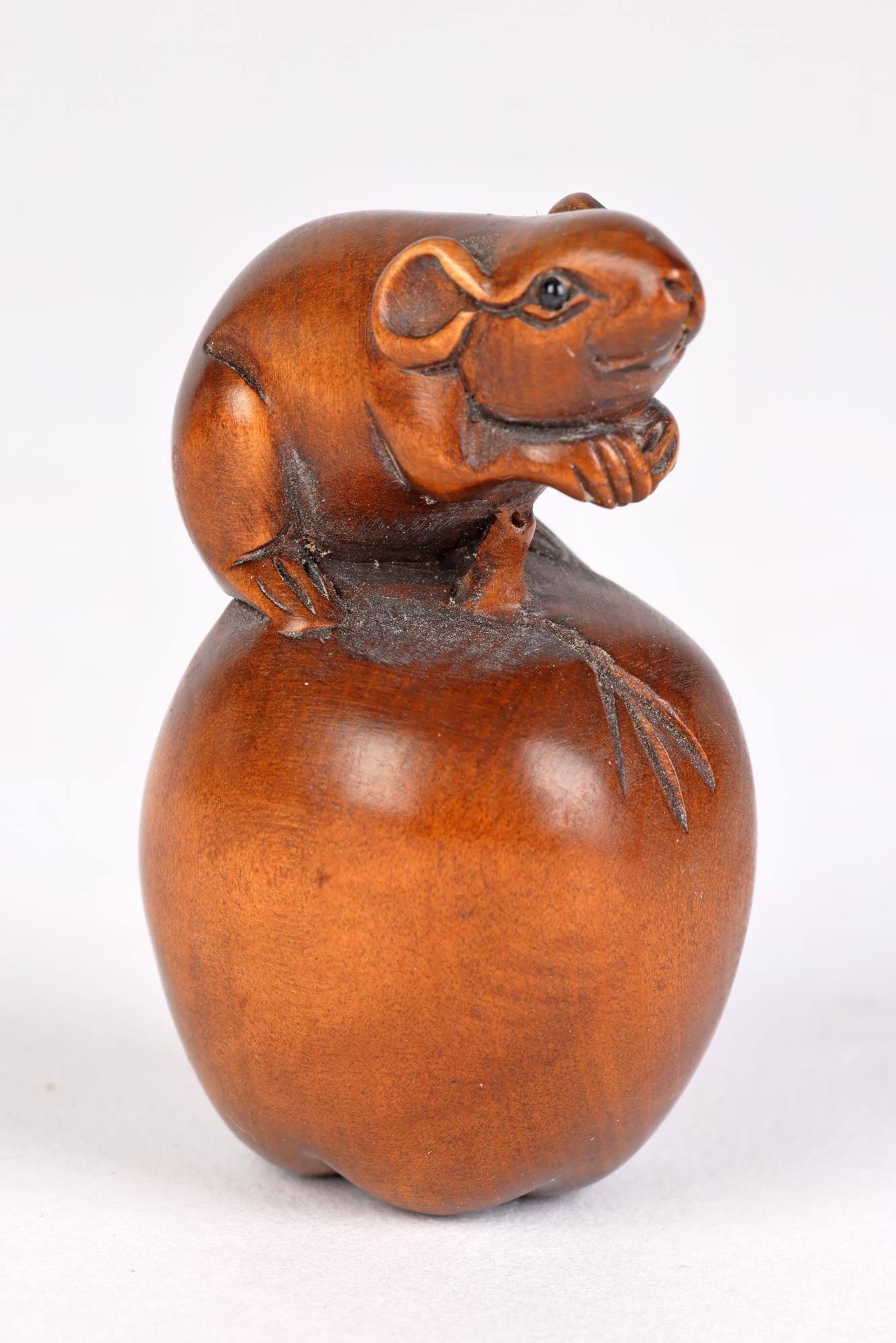 A Japanese collection six carved wood netsukes portraying animals and fish and dating from the latter 20th century. The figures are well carved with good detail and portray the following subjects:
A seated Hare
A Tortoise with young
A mouse on an