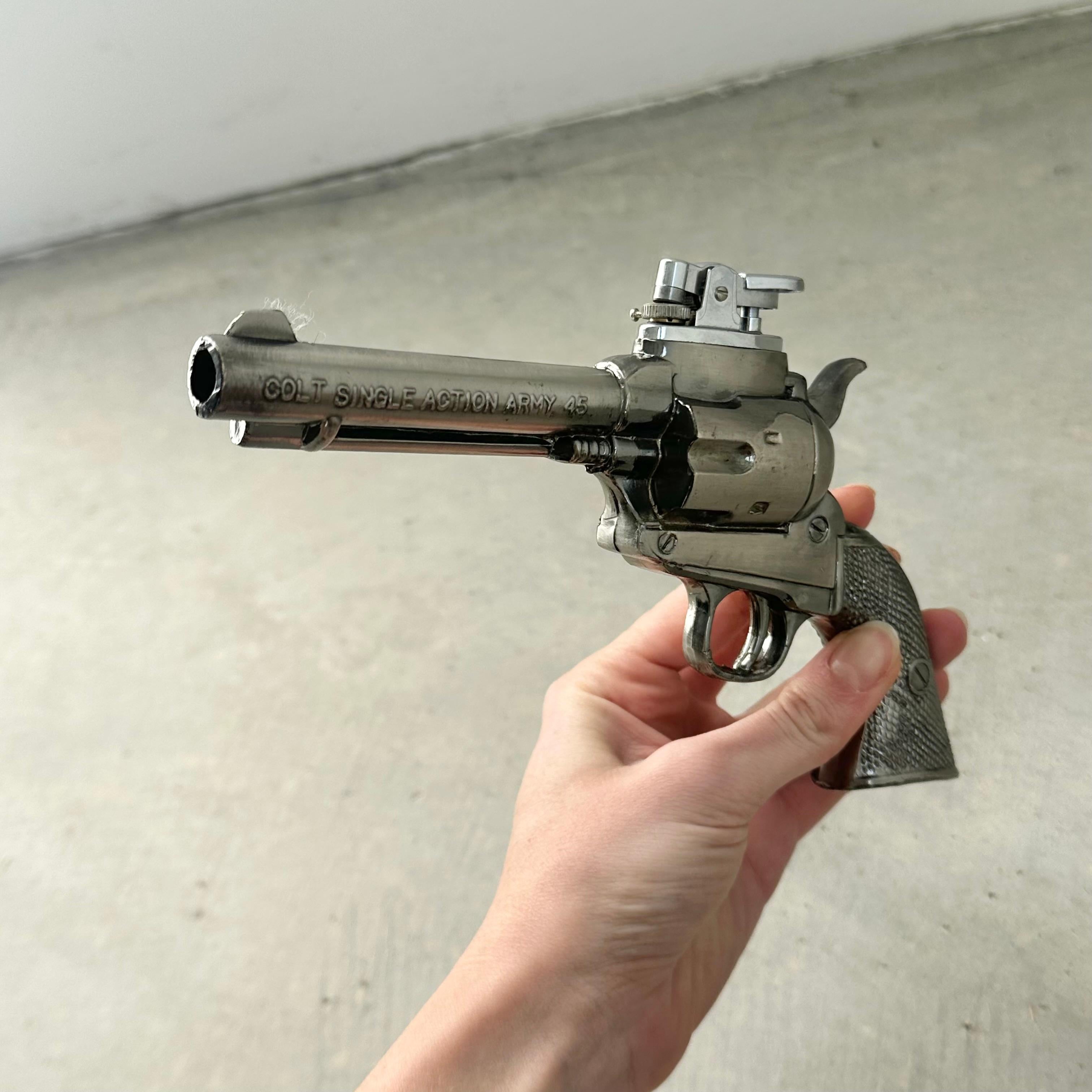 Fun vintage table lighter in the shape of a Colt Revolver. Made in Japan with 
