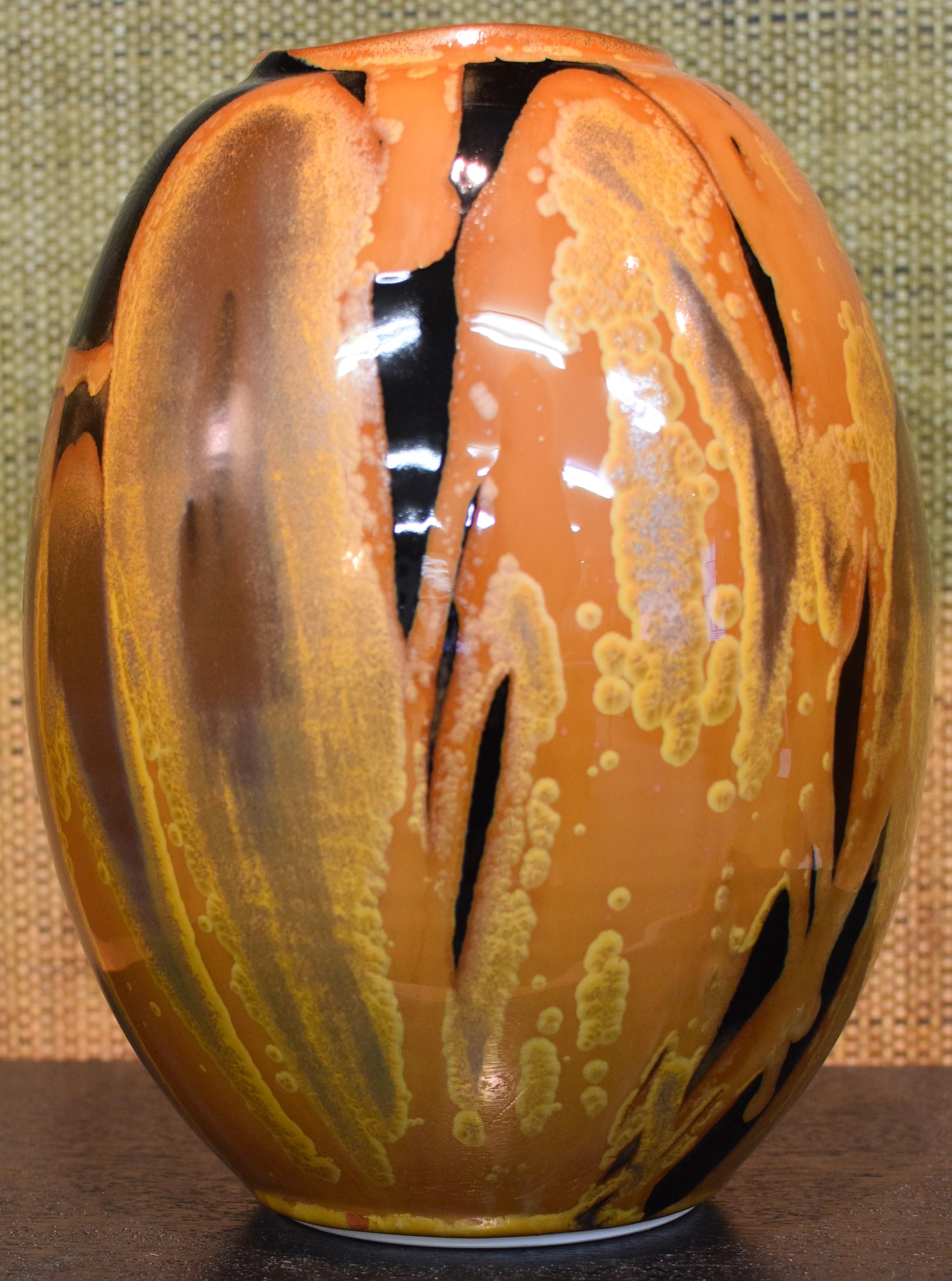 Unique Japanese contemporary hand-glazed decorative ceramic vase in a striking form in stunning caramel, black and gold, a signed work by a highly acclaimed ceramic artist known for his signature caramel, green, purple, wine red and turquoise