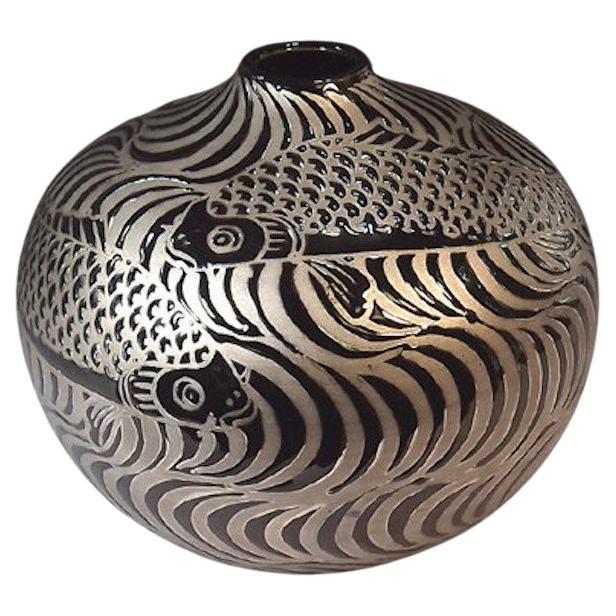 Japanese contemporary decorative porcelain vase, dramatically hand painted in platinum, set against a stunningly shaped porcelain body in black, a signed masterpiece belonging to the artist's signature fish collection by highly acclaimed master