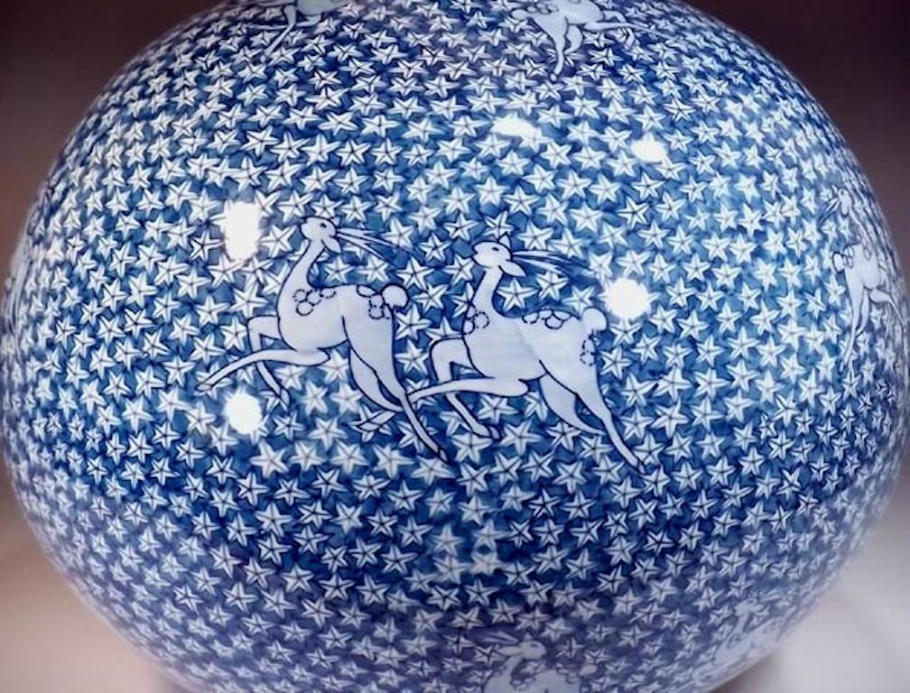 Exceptional contemporary Japanese decorative porcelain vase, intricately hand painted in various shades of blue on an elegant ovoid body, a signed piece by master porcelain artist from the Arita-Imari region in Japan. In 2016, the British Museum