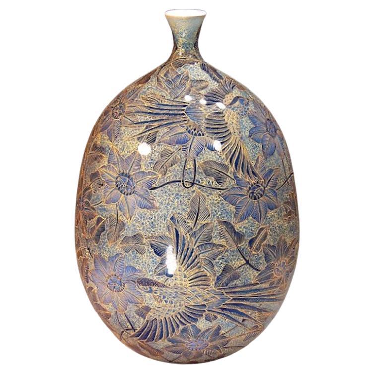 Extraordinary Japanese contemporary museum quality decorative porcelain vase, extremely intricately hand painted on an elegantly shaped porcelain body in blue, with extremely intricate patterns and extensive use of high purity gold, creating a