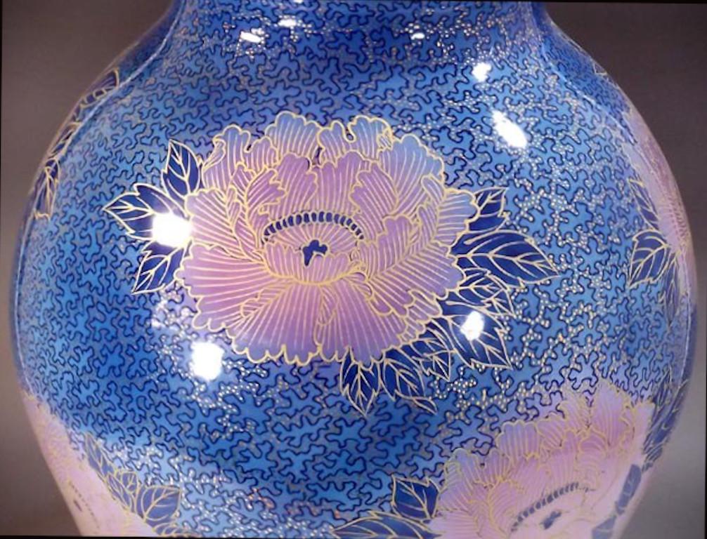 Exquisite large contemporary Japanese decorative porcelain vase, intricately hand painted on a stunningly shaped porcelain body in beautiful shades of blue and pink to create a transparent surface. It is lavishly decorated with generous intricate
