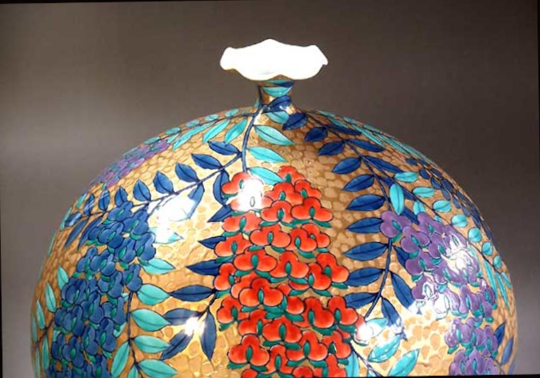 Extraordinary Japanese contemporary dimpled decorative porcelain vase, a stunning piece gilded and hand painted by highly acclaimed porcelain artist of Japan’s Imari-Arita region. This master artist is the recipient of numerous awards for his