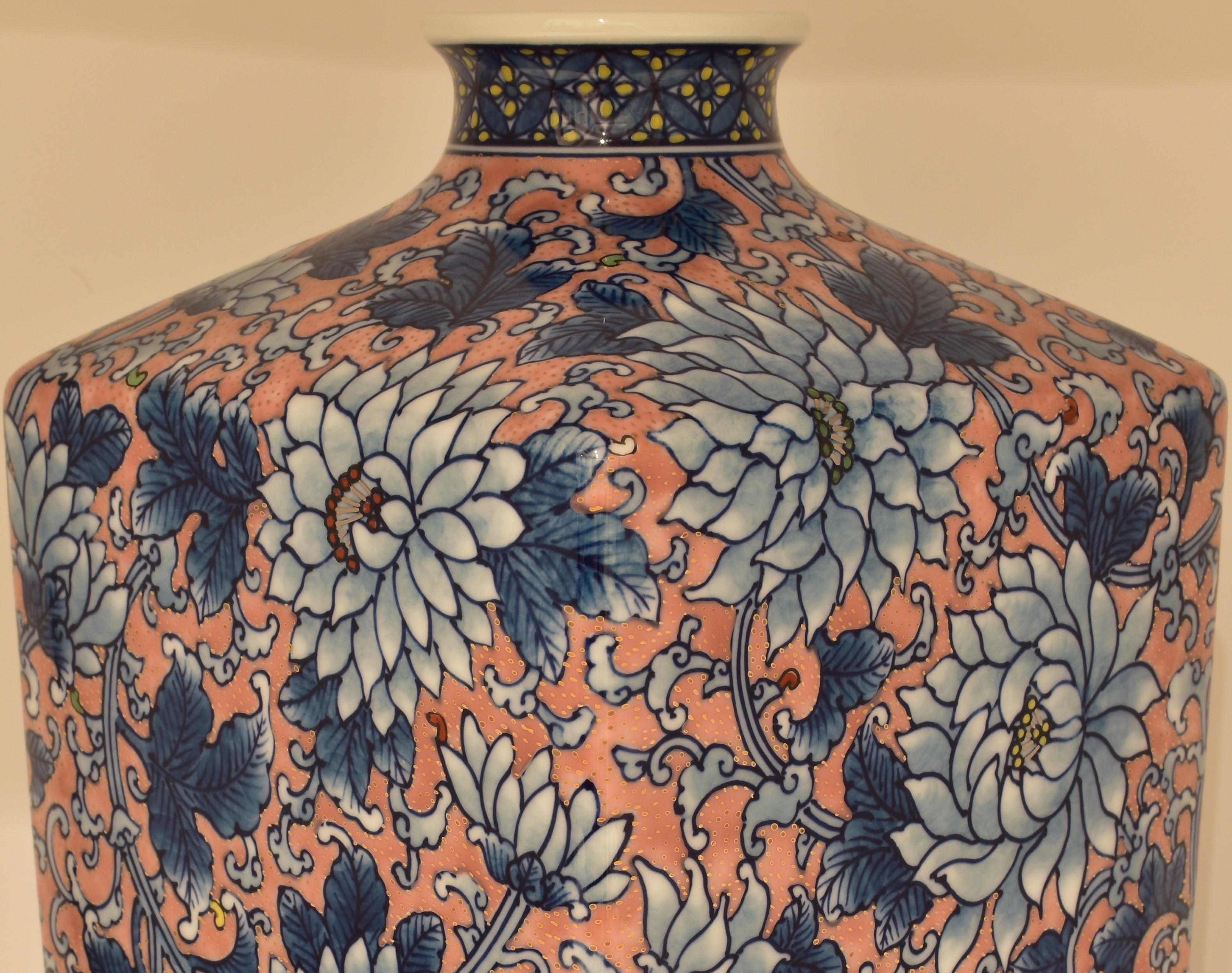 Extraordinary Japanese contemporary museum-quality decorative vase, a masterpiece intricately hand-painted on a rectangular body of the finest Arita porcelain, which provides the perfect canvas for a subtly gilded field of chrysanthemums in full