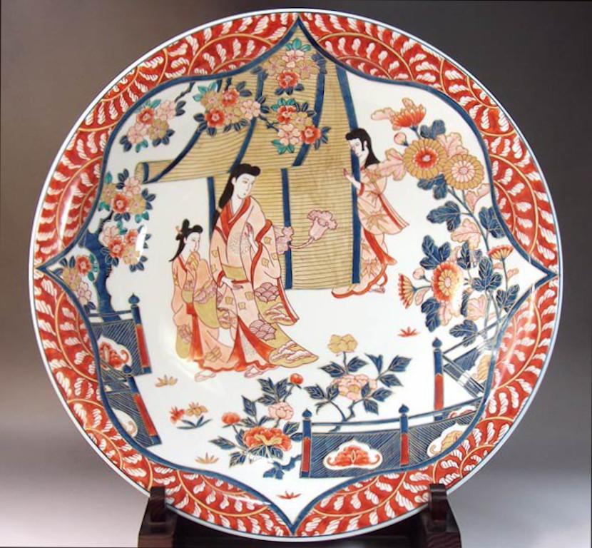Exquisite contemporary Japanese decorative porcelain charger, stunningly hand painted in blue, pink and red, a signed masterpiece by widely respected award-winning master porcelain artist of the Imari-Arita region of Japan. In 2016, the British