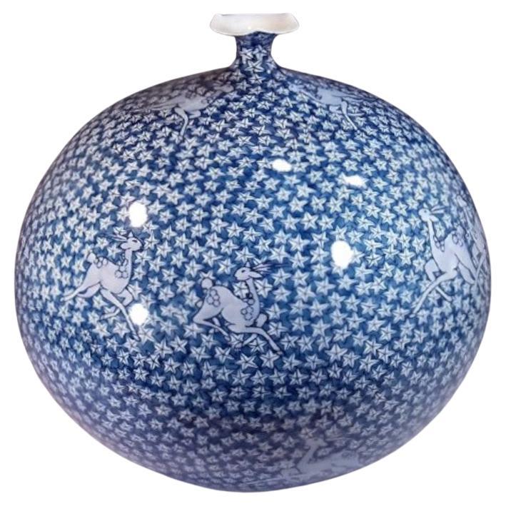 Contemporary Japanese decorative porcelain vase, intricately hand painted in blue on a stunningly shaped ovoid body, by widely acclaimed master porcelain artist in traditional patterns of the Imari-Arita region of Japan and the recipient of numerous