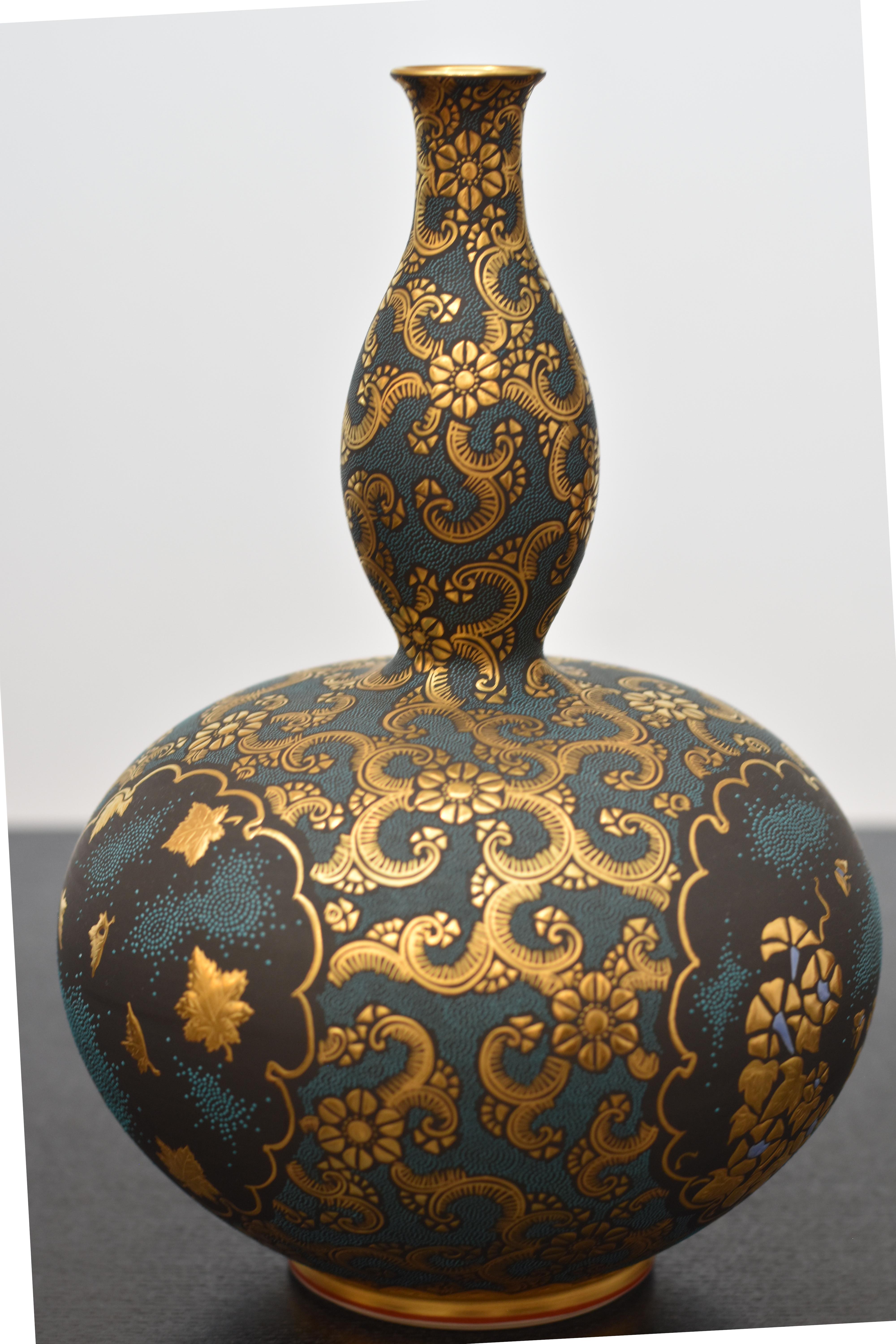 Extraordinary Japanese museum quality contemporary Kutani porcelain vase, extremely intricately hand painted with deep blue raised 