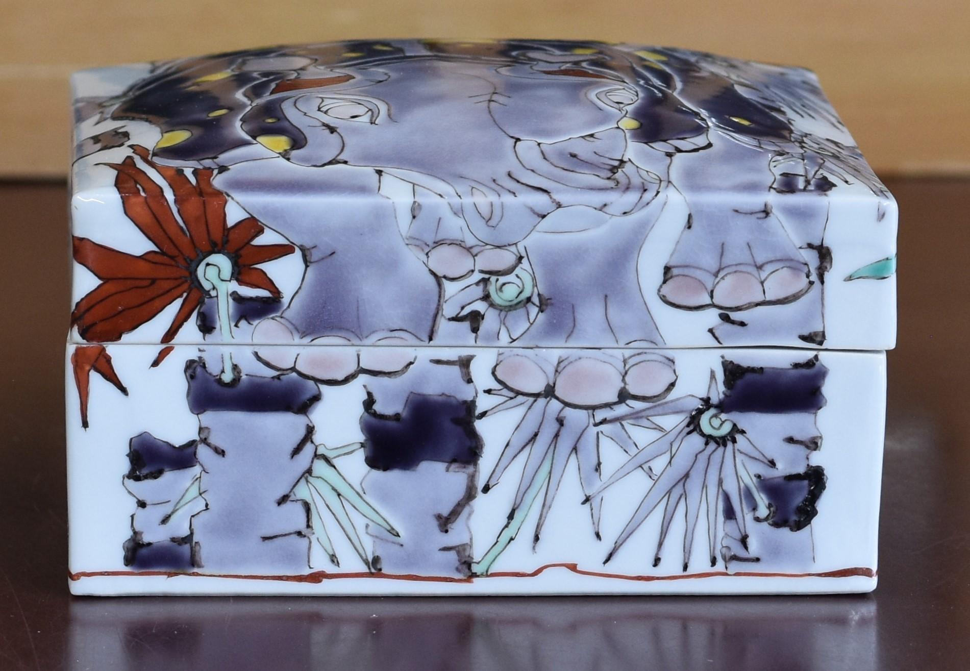 Exquisite Japanese contemporary museum-quality signed decorative porcelain box in an elegant square shape, stunningly gilded and hand painted in vivid hues of purple and blue, showcasing a unique interpretation of the rhinoceros by highly acclaimed