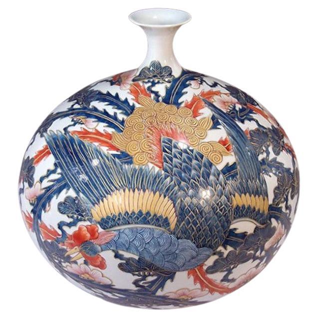 Unique contemporary Japanese decorative Porcelain vase, intricately gilded and hand painted in hues of red, blue and gold on a striking globular body, a signed work by highly acclaimed award-winning master porcelain artist of the Imari-Arita region