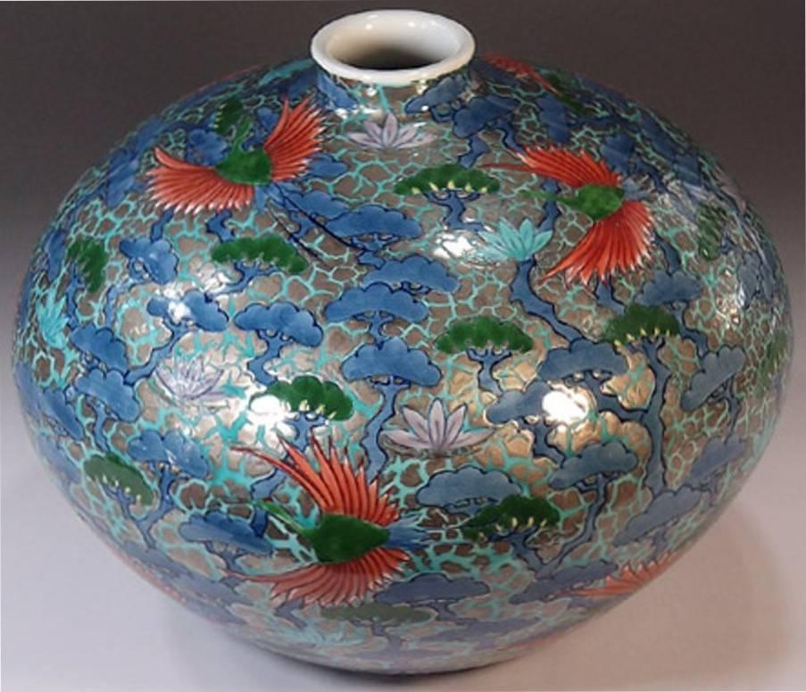 Exquisite contemporary Japanese dimpled decorative porcelain vase in blue and red on platinum, an elegant piece hand painted by a highly acclaimed porcelain artist of Japan’s Imari-Arita region. The artist is the recipient of numerous awards for his