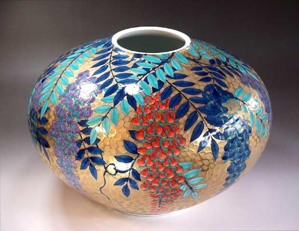Mesmerizing Japanese contemporary dimpled gilded signed decorative porcelain vase, an exquisite masterpiece hand painted by widely acclaimed master porcelain artist of Japan’s Imari-Arita region. The artist is the recipient of numerous awards for