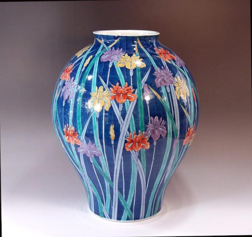 Japanese contemporary decorative porcelain vase, hand painted in vivid dark blue, yellow, red and purple and signed by a widely acclaimed master porcelain artist of Japan’s Imari-Arita region. He is the recipient of numerous awards for his