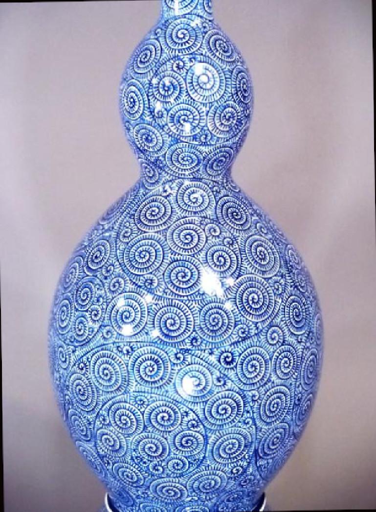 Graceful Japanese contemporary very large three-piece decorative porcelain lidded vase, extremely intricately hand painted in underglaze cobalt blue on an auspicious double-gourd body, a signed work by highly acclaimed master porcelain artist of the