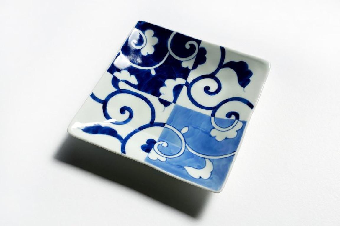 Exceptional Japanese contemporary porcelain dessert/fruit/bread plate in an elegant square shape, hand-painted in blue underglaze in cobalt and light blue to showcase a graceful arabesque or karakusa pattern on a background of squares in blue and