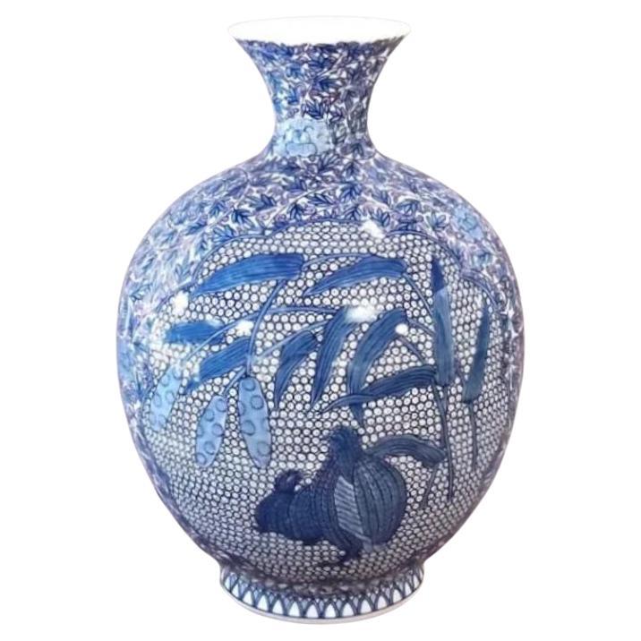Japanese Contemporary porcelain decorative vase, extremely intricately hand painted in underglaze cobalt blue on an elegant ovoid shape porcelain body, a signed piece by widely acclaimed Japanese master porcelain artist in the Imari-Arita tradition