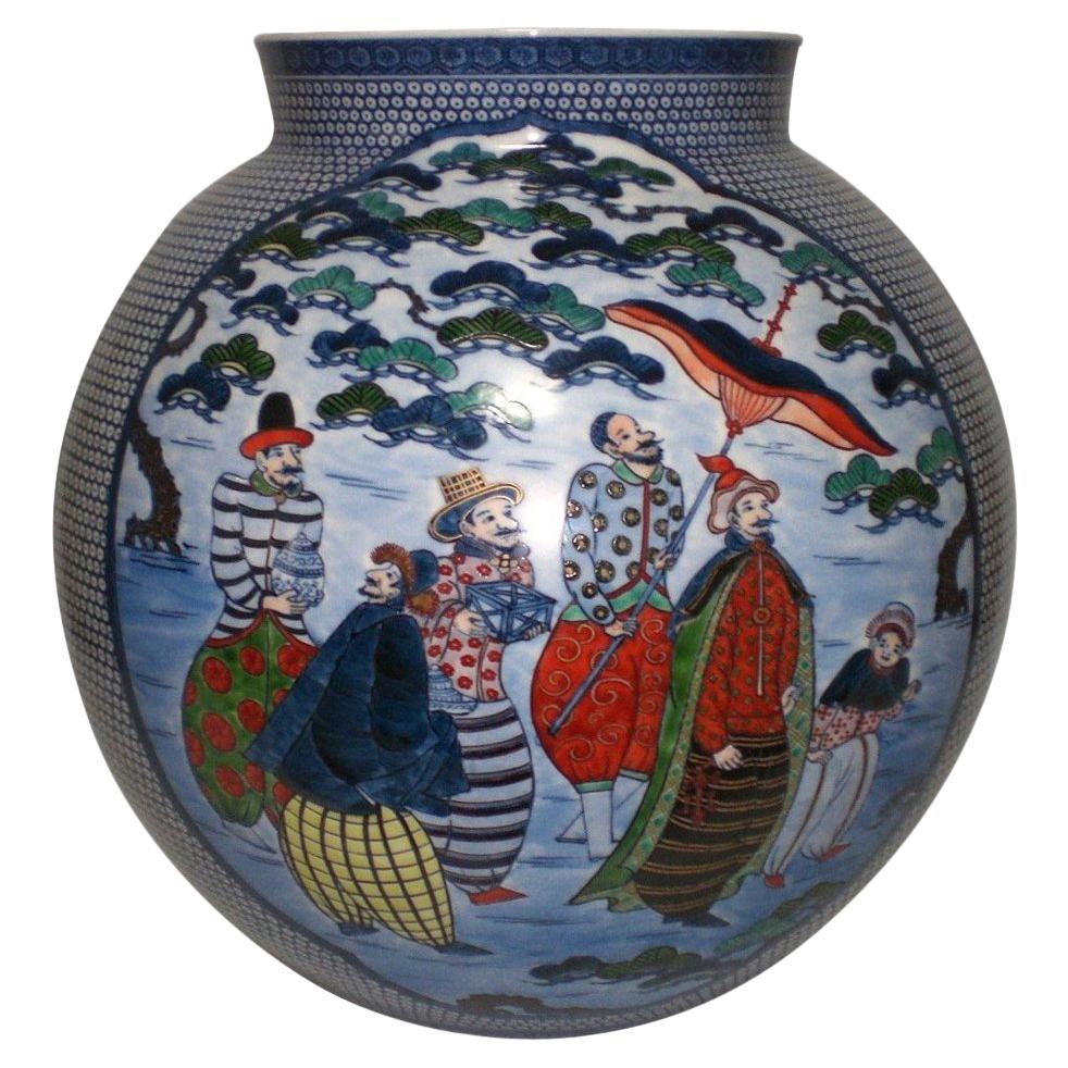 Exceptional Japanese contemporary museum quality decorative porcelain vase, extremely intricately hand-painted in blue, red, yellow and green on a stunning ovoid shape body, a signed masterpiece by a highly acclaimed award-winning second-generation