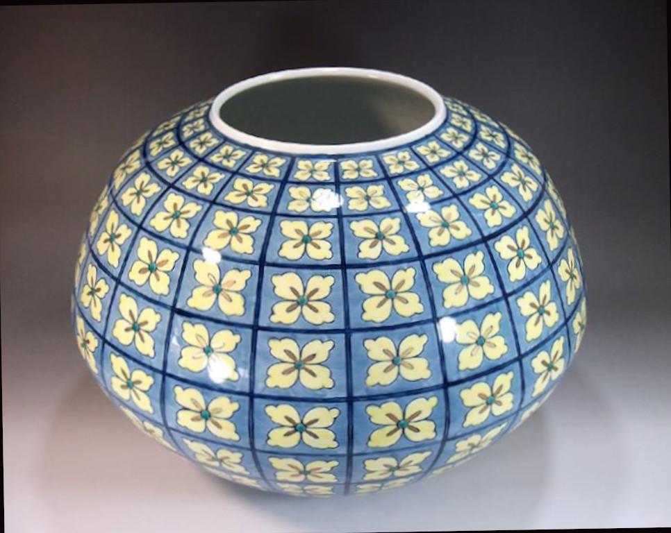Exquisite large Japanese contemporary decorative Porcelain vase featuring a “flowers-in-the-wind” motif in blue and yellow, a stunningly shaped porcelain vase, a signed piece by widely acclaimed master porcelain artist of the Imari-Arita region of