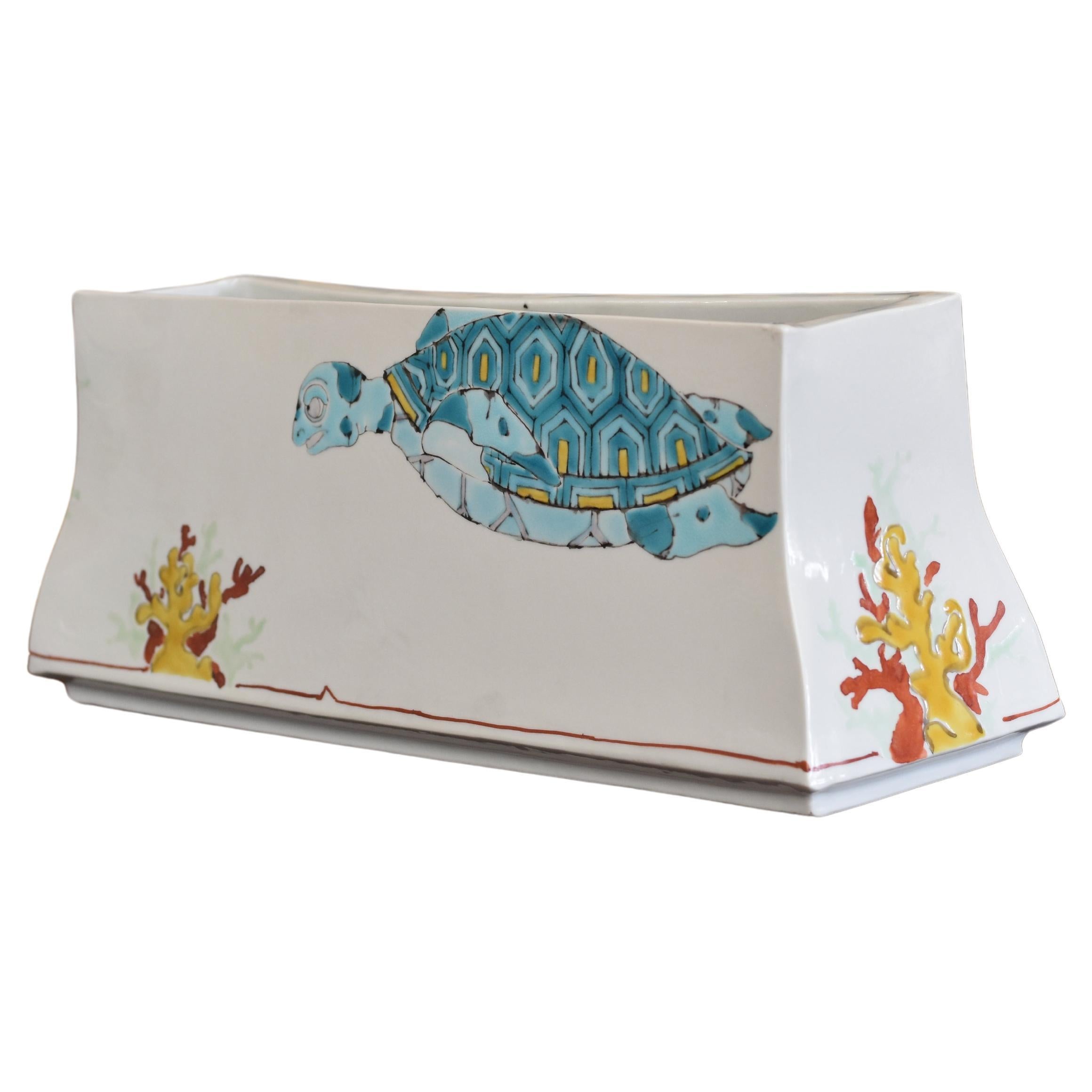 Extraordinary museum-quality Japanese contemporary signed decorative porcelain vase, stunningly hand painted on an elegant rectangular body in vivid hues of blue, yellow and red, with a unique interpretation of sea turtle. This highly acclaimed