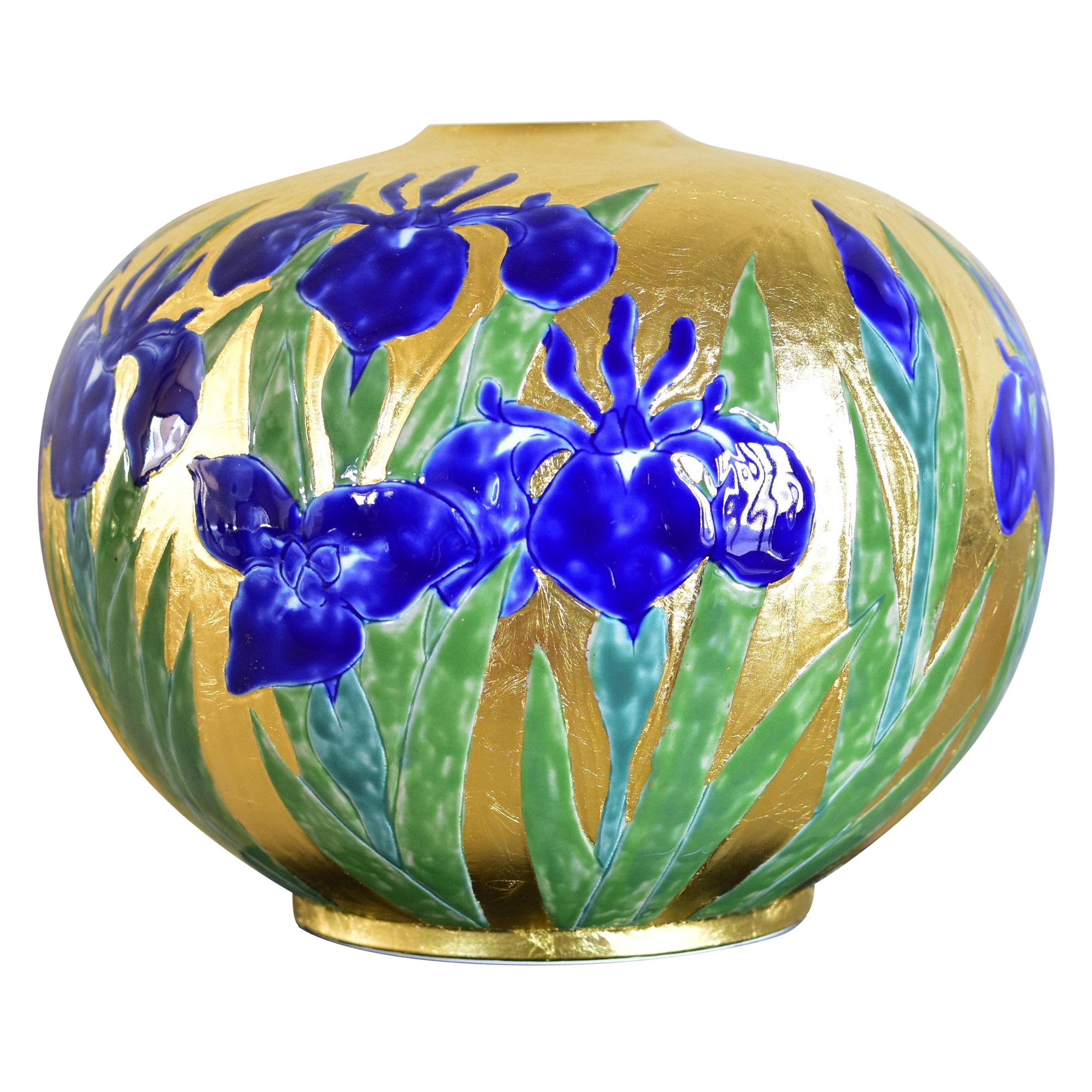 Exquisite Japanese contemporary porcelain vase in gold leaf decorated withhand-paintings in deep blue and beautiful shades of green on a stunningly shaped body. This piece is by a third generation master of a kiln located in the Imari-Arita region