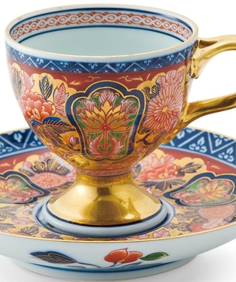 Exceptional contemporary Ko-Imari (Old Imari) style gilded hand painted porcelain cup and saucer. This extraordinary piece brings back the glory and beauty of Ko-Imari style with its generous application of gold and bold patterns in vivid red, blue