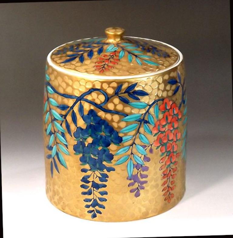 Exceptional Japanese contemporary signed porcelain Mizusashi/lidded water Jar in a striking dimpled body, showcasing intricately hand-painted clusters of cherry blossoms in blue, purple and iron red, set against a dimpled background in gold, a