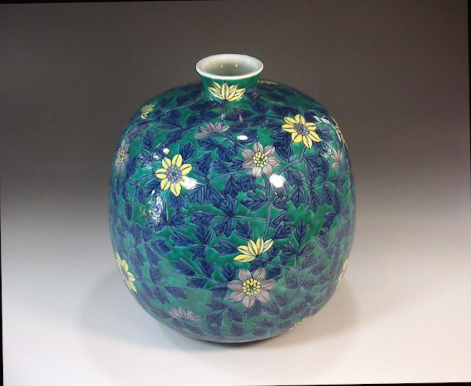 Exceptional Japanese contemporary decorative porcelain vase, stunningly hand painted in yellow, green and blue, a signed piece by highly acclaimed master porcelain artist. The artist is the recipient of numerous awards for his exceptional porcelain